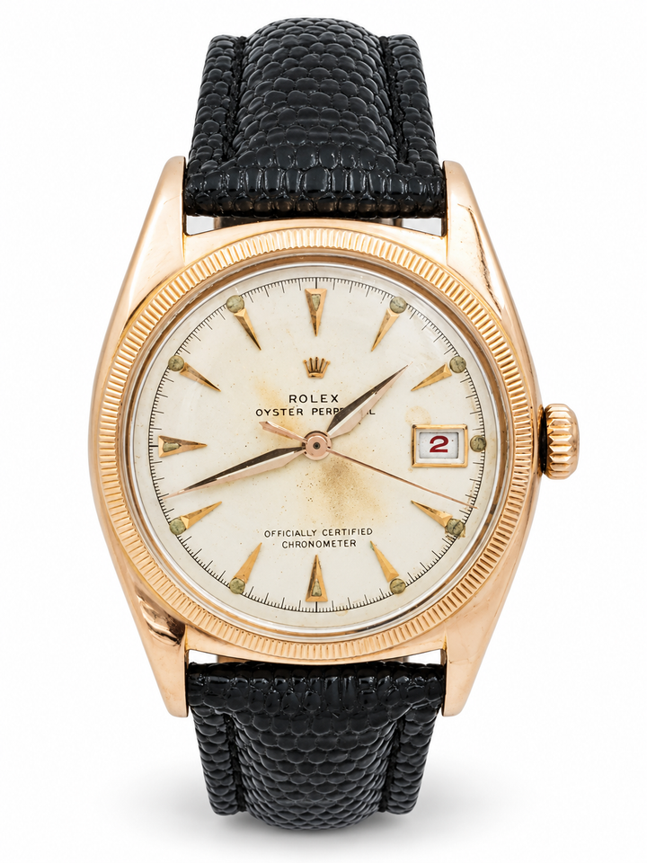 *1950 Men's Rolex 36mm Vintage Bubbleback Oyster Perpetual Rose Gold Watch with Cream Dial and Black Leather Strap. (Pre-Owned 6075)