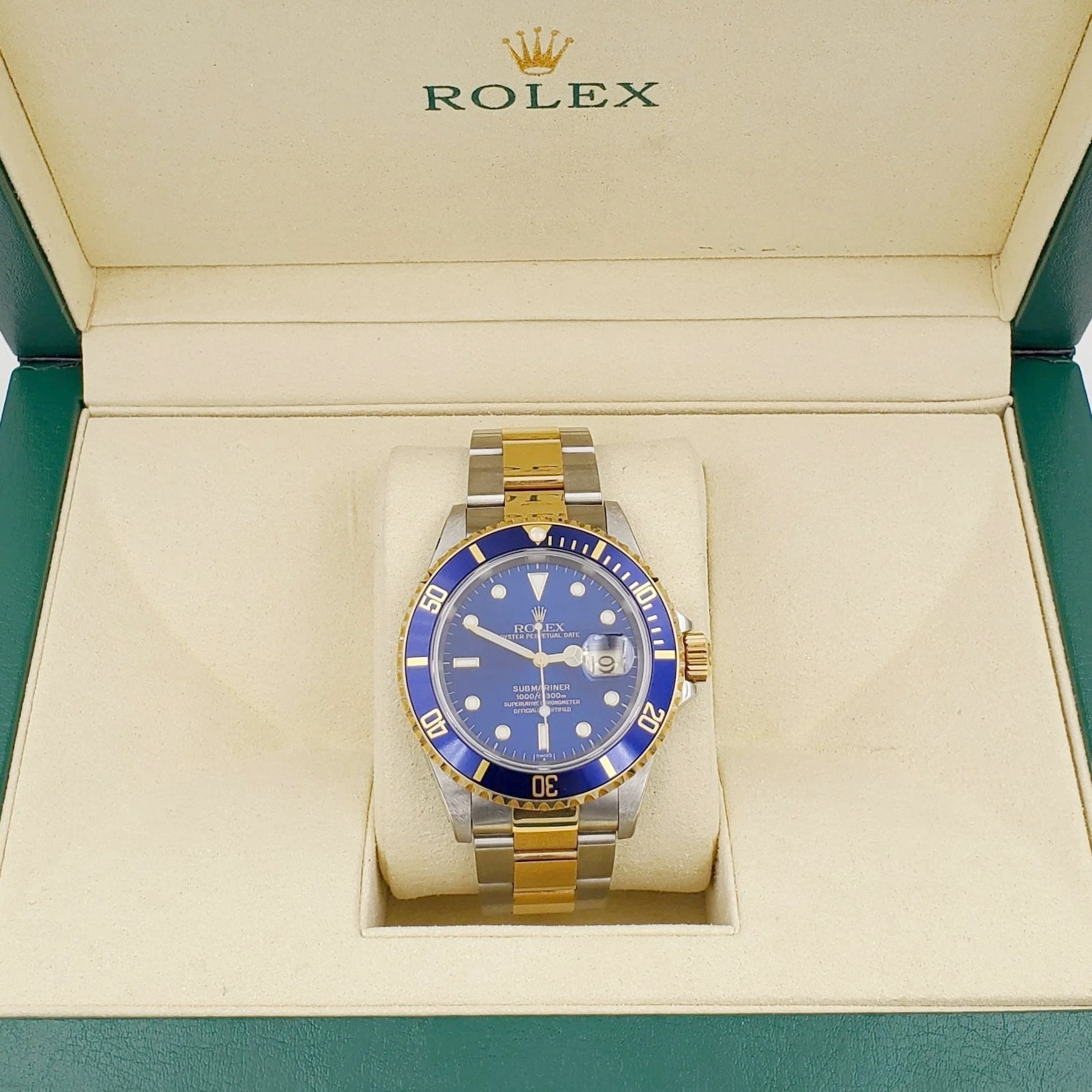 1996 Men's Rolex 40mm Submariner Oyster Perpetual Two Tone 18K Yellow Gold / Stainless Steel Watch with Blue Dial and Blue Bezel. (Pre-Owned 16613)