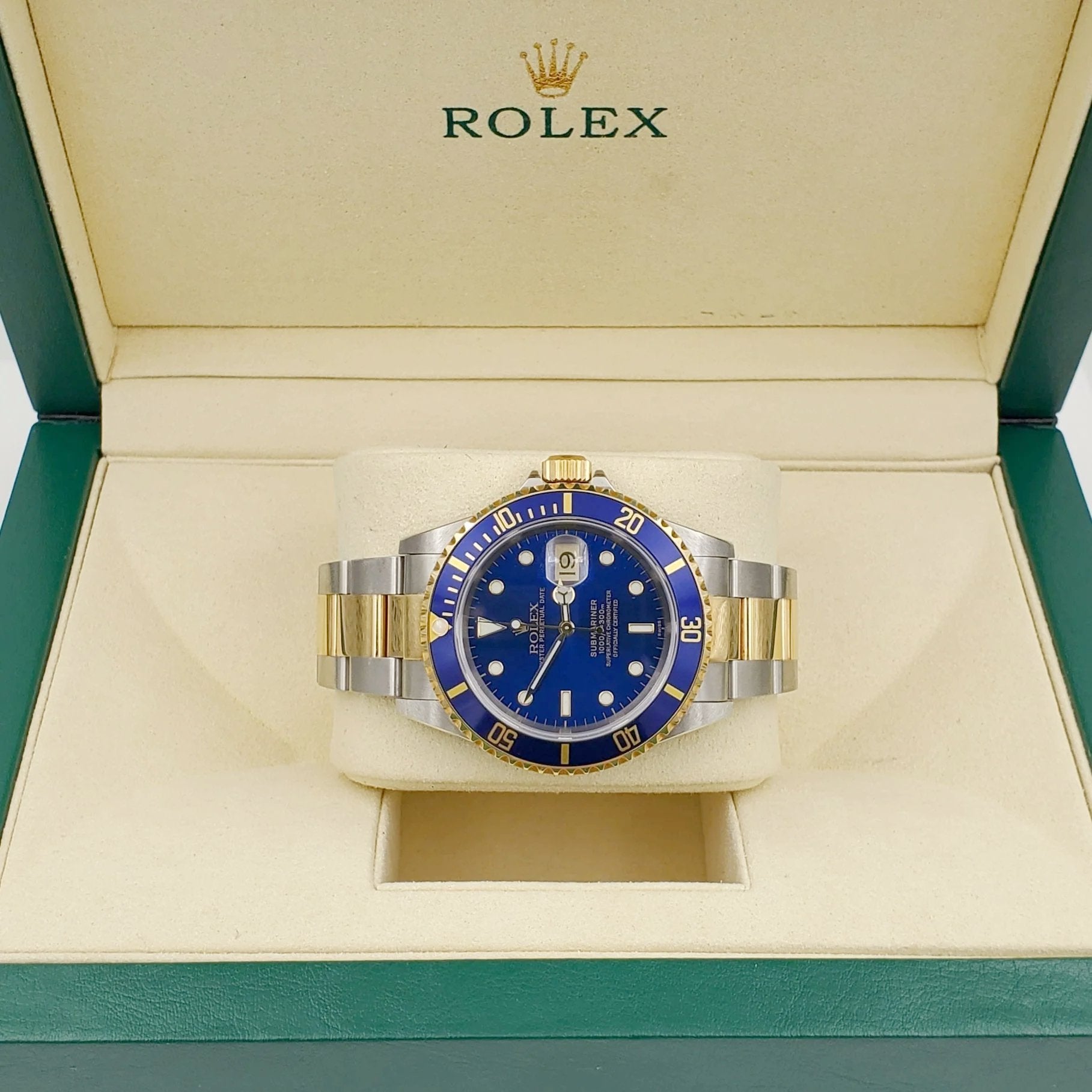 1996 Men's Rolex 40mm Submariner Oyster Perpetual Two Tone 18K Yellow Gold / Stainless Steel Watch with Blue Dial and Blue Bezel. (Pre-Owned 16613)