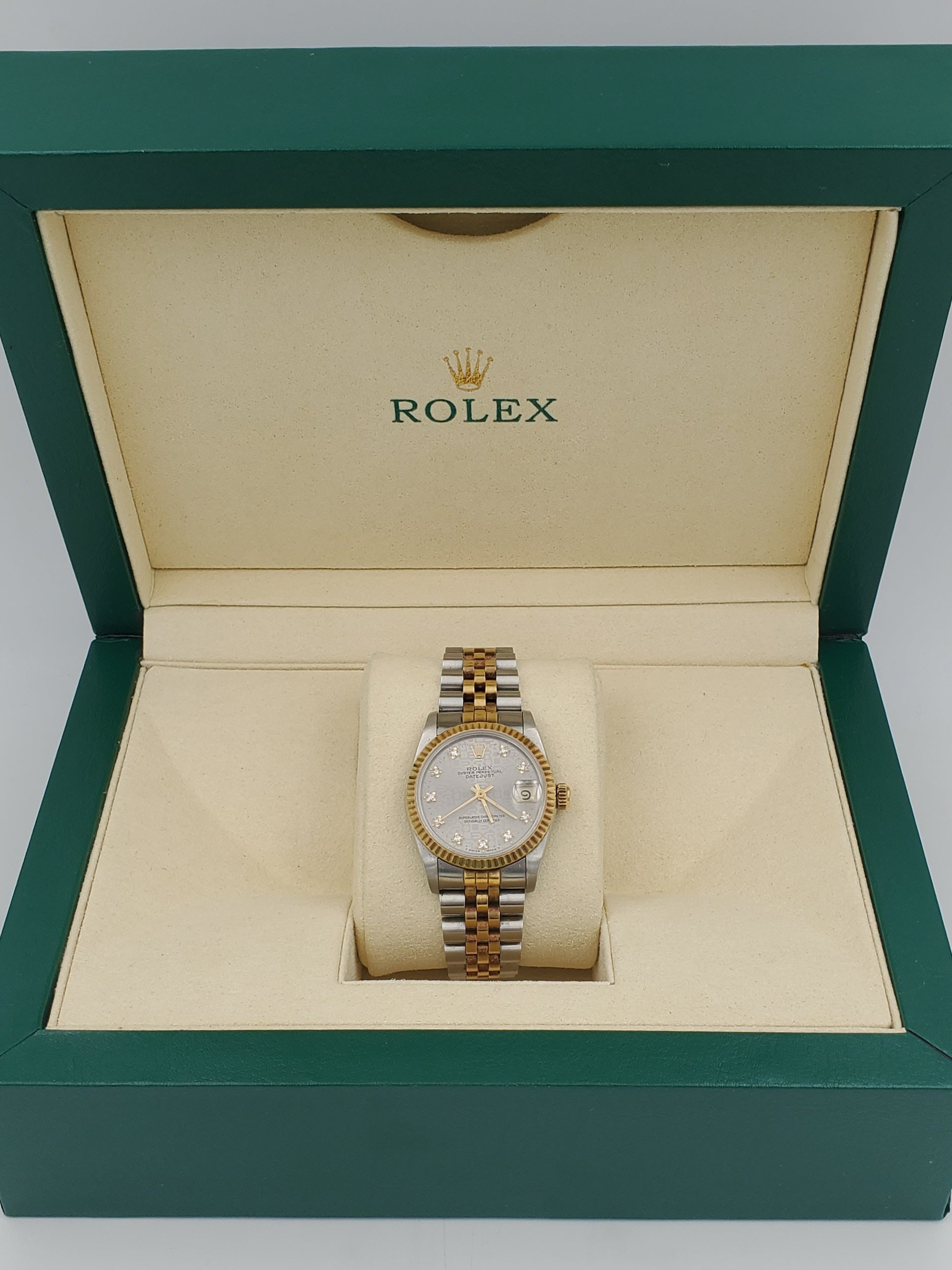 Ladies Rolex Midsize 31mm DateJust Two Tone 18K Yellow Gold / Stainless Steel Wristwatch w/ Silver Diamond Dial & Fluted Bezel. (Pre-Owned 682735)