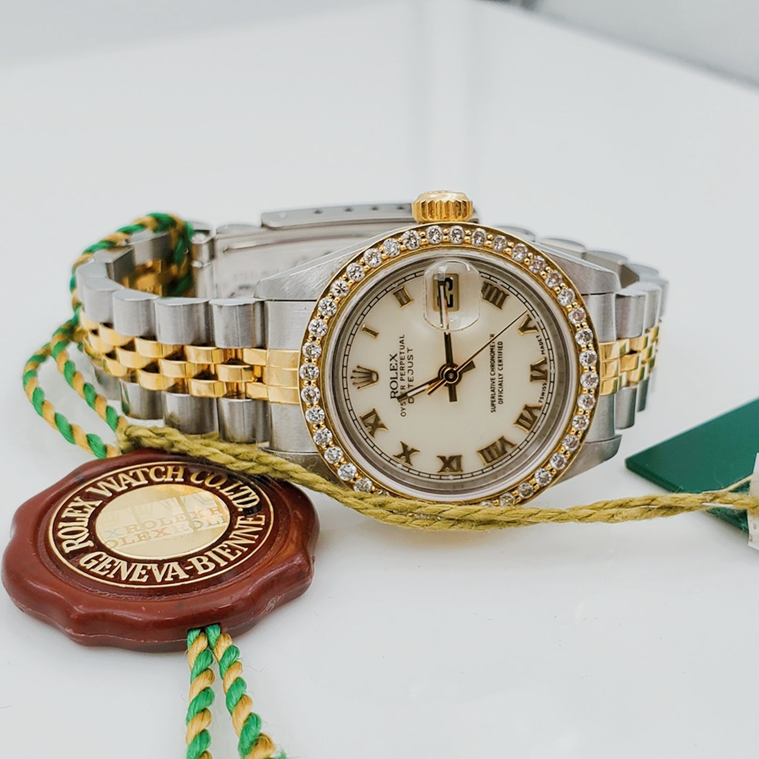 Ladies Rolex 18K Gold Two Tone 26mm DateJust Wristwatch w/ Off-White Dial, Roman Numerals & Diamond Bezel. (Pre-Owned)