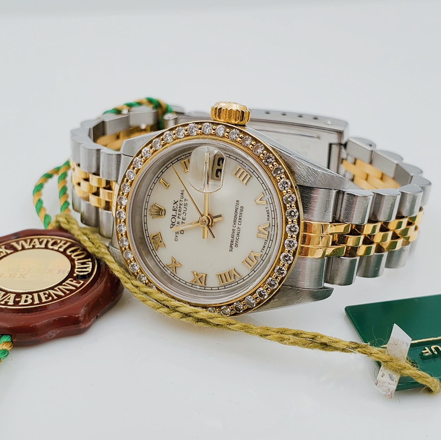 Ladies Rolex 18K Gold Two Tone 26mm DateJust Wristwatch w/ Off-White Dial, Roman Numerals & Diamond Bezel. (Pre-Owned)