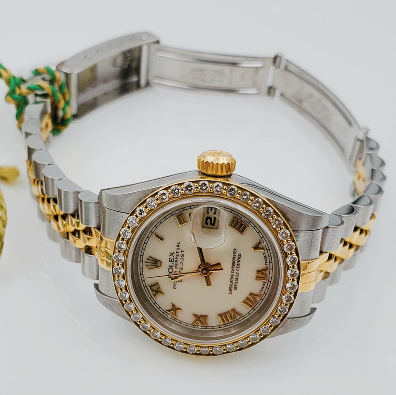 Ladies Rolex 18K Gold Two Tone 26mm DateJust Wristwatch w/ Off-White Dial, Roman Numerals & Diamond Bezel. (Pre-Owned)