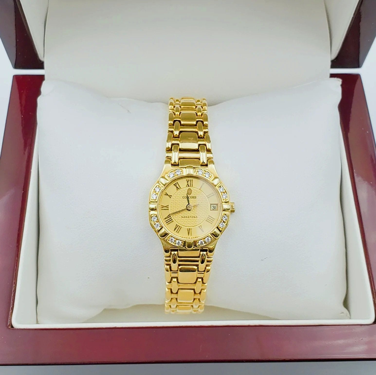 Ladies Concord Sarento 24mm Solid 18K Yellow Gold Wristwatch with Roman Numeral Gold Dial & Diamond Bezel. (Pre-Owned)