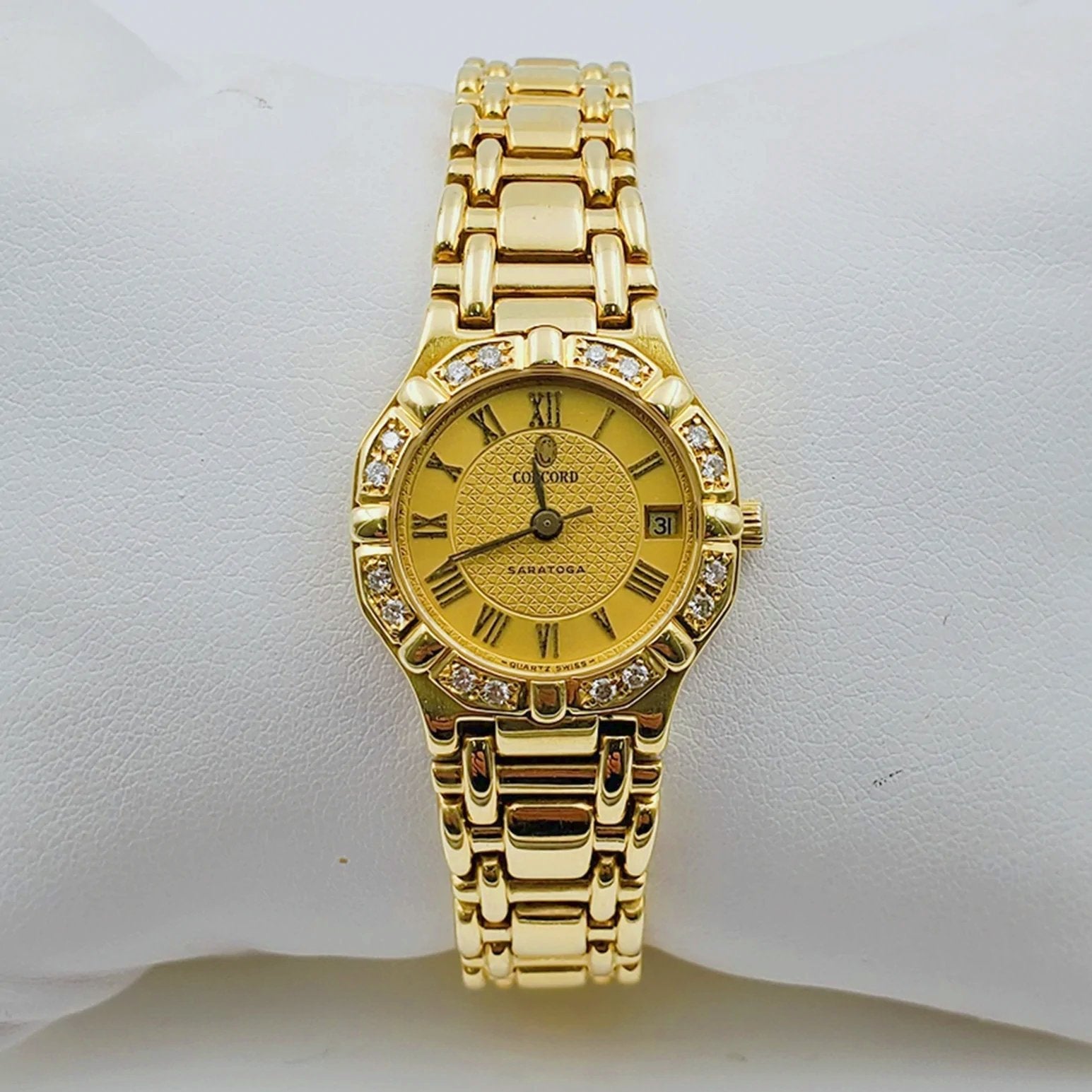 Ladies Concord Sarento 24mm Solid 18K Yellow Gold Wristwatch with Roman Numeral Gold Dial & Diamond Bezel. (Pre-Owned)