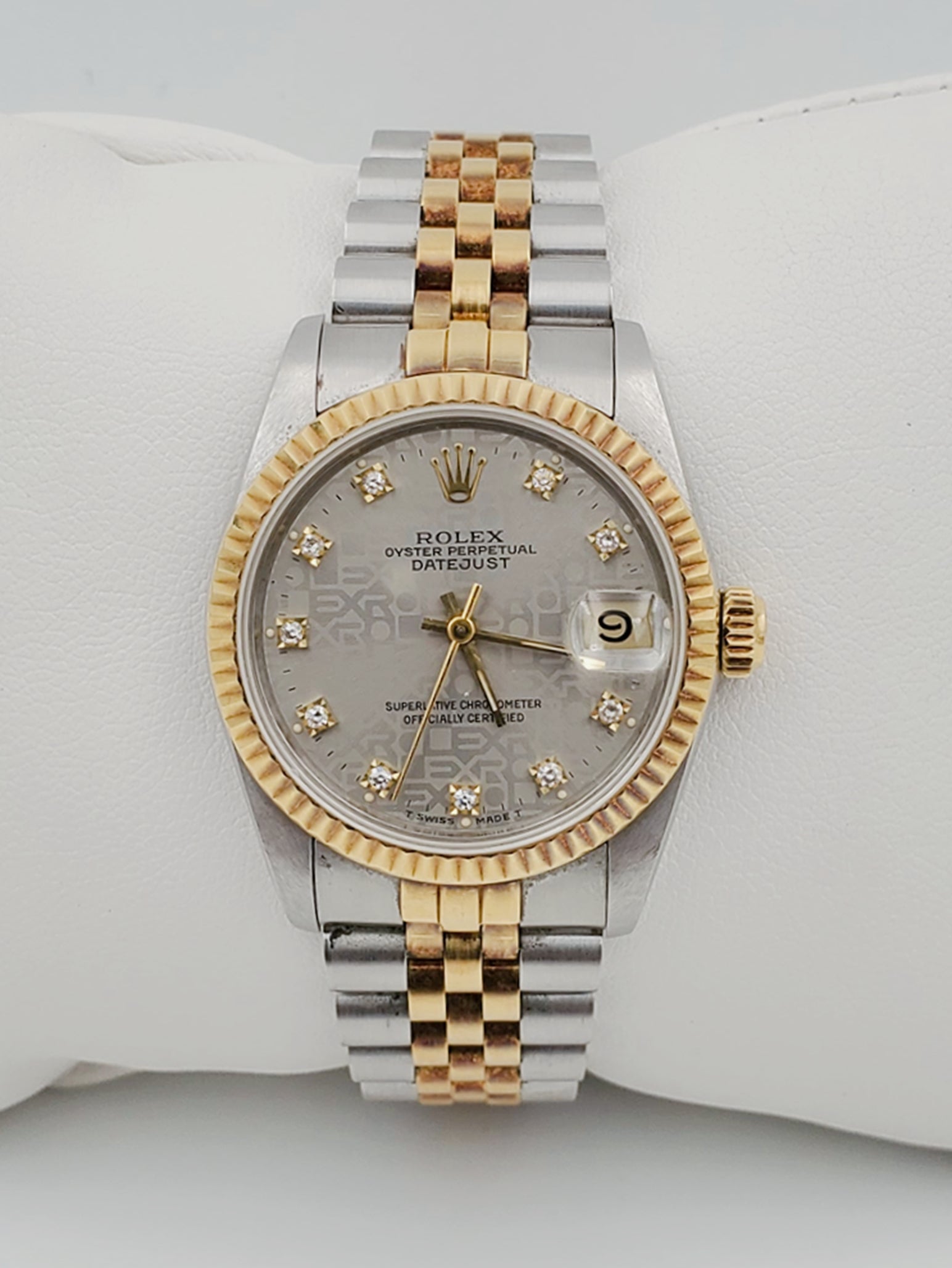 Ladies Rolex Midsize 31mm DateJust Two Tone 18K Yellow Gold / Stainless Steel Wristwatch w/ Silver Diamond Dial & Fluted Bezel. (Pre-Owned 682735)