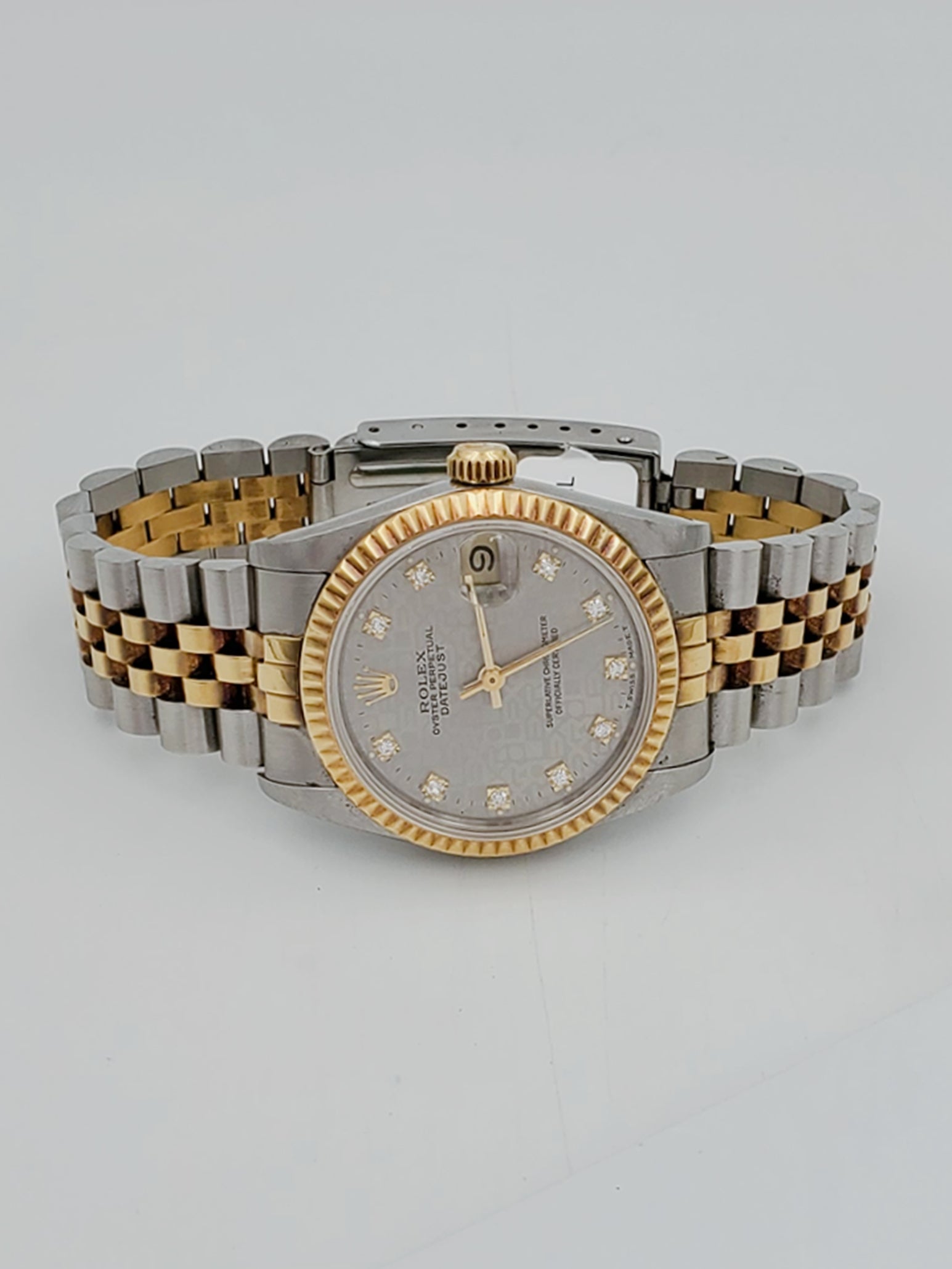 Ladies Rolex Midsize 31mm DateJust Two Tone 18K Yellow Gold / Stainless Steel Wristwatch w/ Silver Diamond Dial & Fluted Bezel. (Pre-Owned 682735)