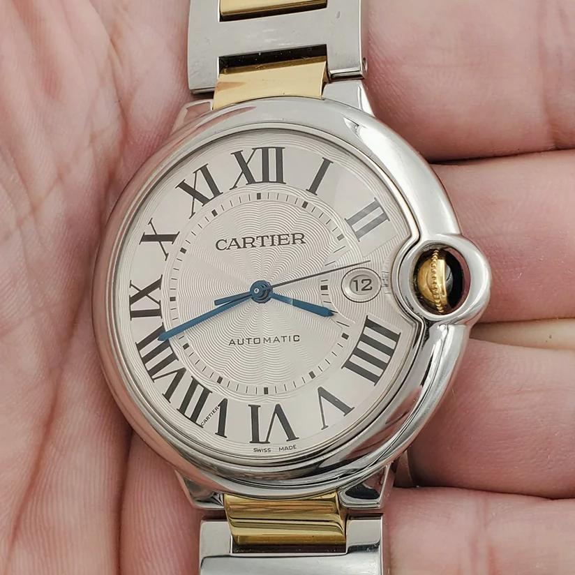 Men's Cartier 42mm Ballon Bleu Two Tone 18K Yellow Gold / Stainless Steel Wristwatch with Roman Numeral Silver Dial & Smooth Bezel. (NEW W2BB0031)