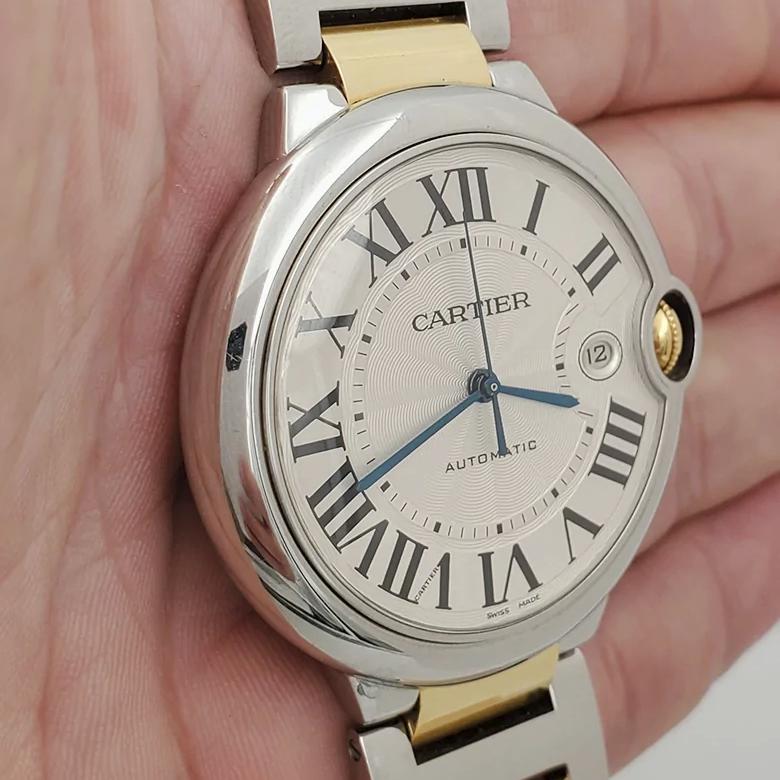 Men's Cartier 42mm Ballon Bleu Two Tone 18K Yellow Gold / Stainless Steel Wristwatch with Roman Numeral Silver Dial & Smooth Bezel. (NEW W2BB0031)