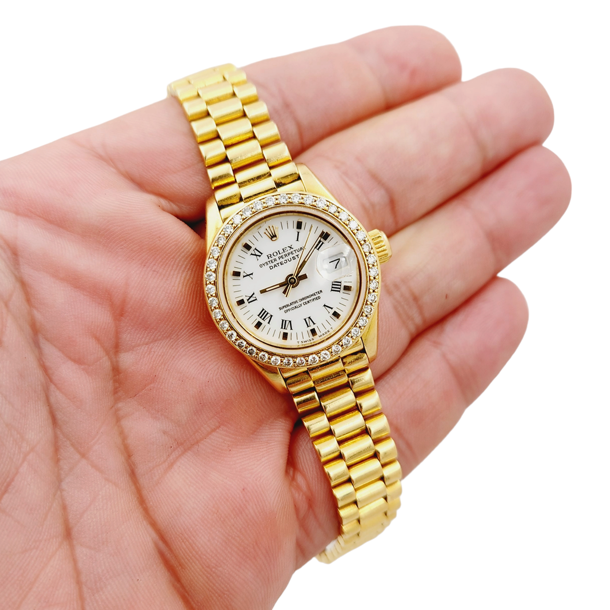 Ladies Rolex 26mm Presidential 18K Yellow Gold Watch with White Roman Numeral Dial and Diamond Bezel. (Pre-Owned 69178)