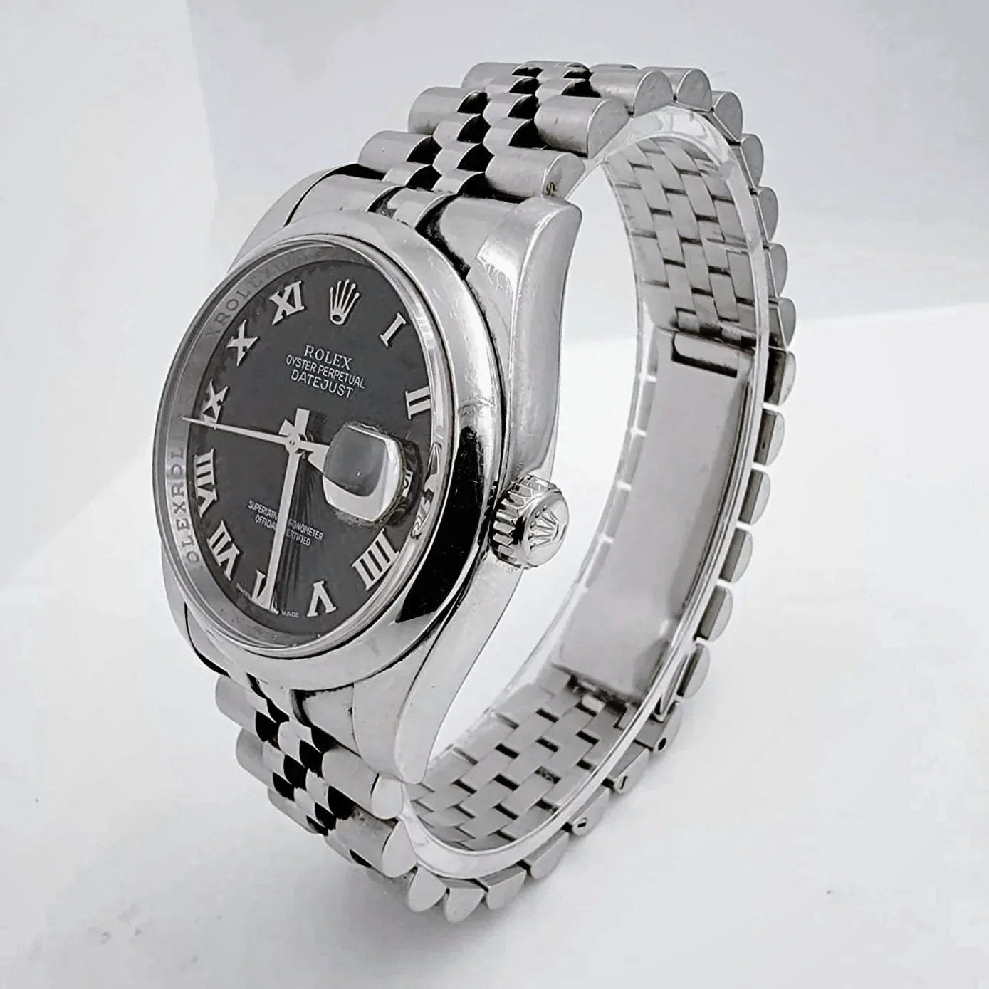 Men's Rolex 36mm Oyster Perpetual DateJust Stainless Steel Watch with Sunbeam Roman Numeral Black Dial and Smooth Bezel. (Pre-Owned 116200)