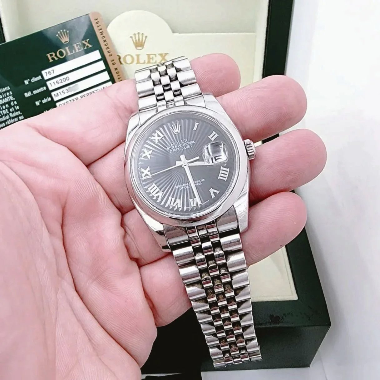 Men's Rolex 36mm Oyster Perpetual DateJust Stainless Steel Watch with Sunbeam Roman Numeral Black Dial and Smooth Bezel. (Pre-Owned 116200)