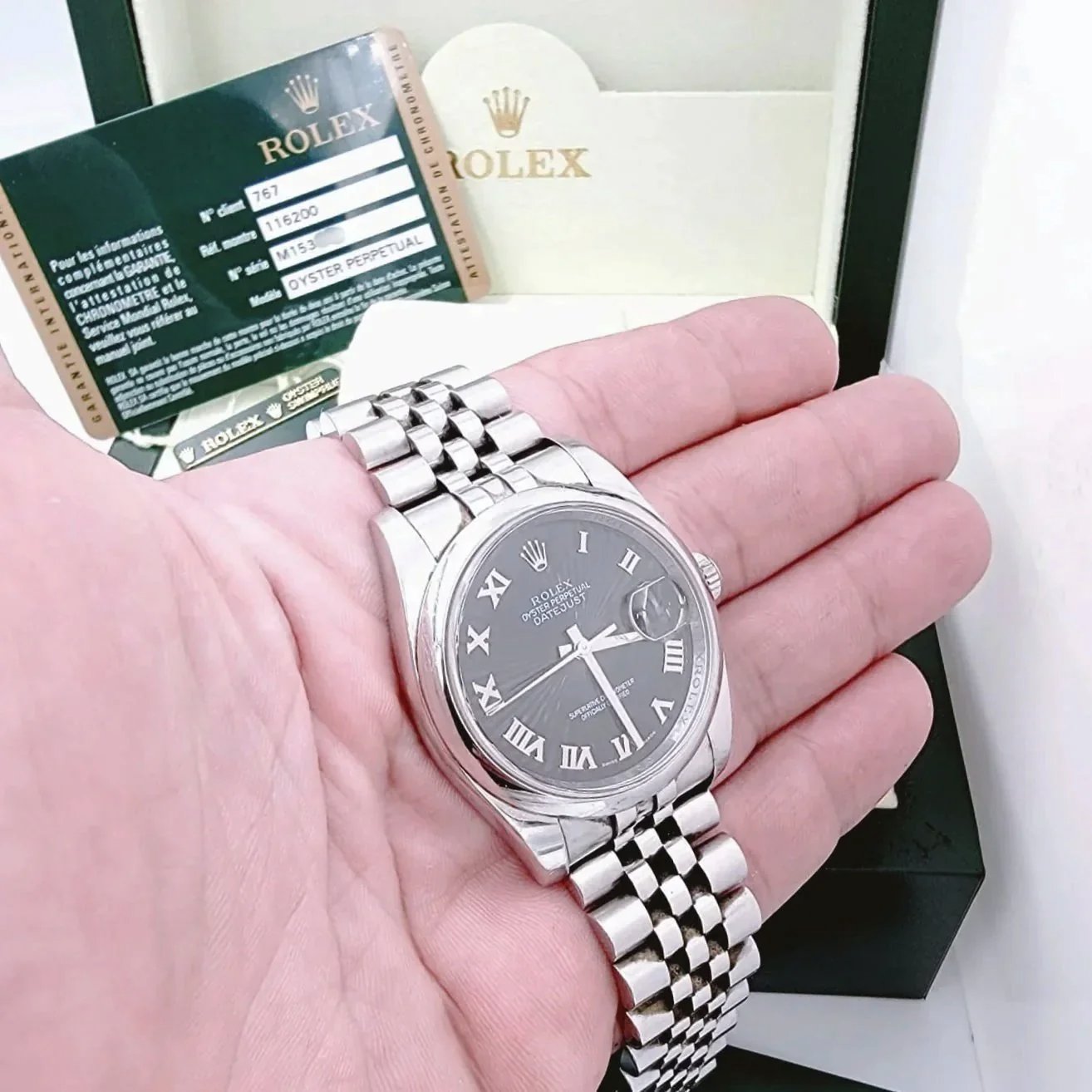 Men's Rolex 36mm Oyster Perpetual DateJust Stainless Steel Watch with Sunbeam Roman Numeral Black Dial and Smooth Bezel. (Pre-Owned 116200)