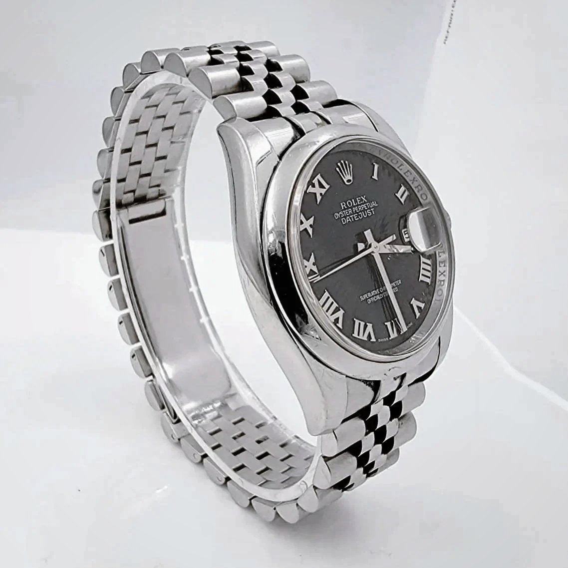 Men's Rolex 36mm Oyster Perpetual DateJust Stainless Steel Watch with Sunbeam Roman Numeral Black Dial and Smooth Bezel. (Pre-Owned 116200)
