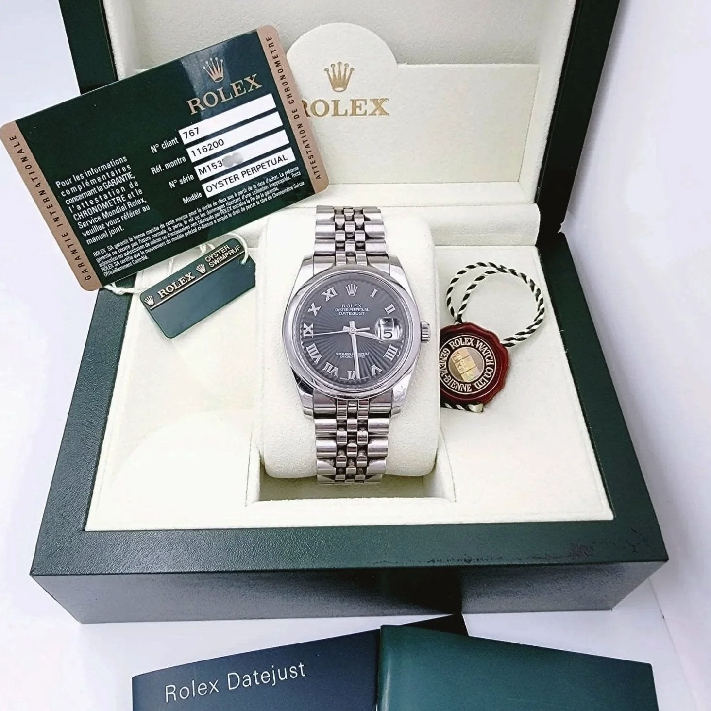 Men's Rolex 36mm Oyster Perpetual DateJust Stainless Steel Watch with Sunbeam Roman Numeral Black Dial and Smooth Bezel. (Pre-Owned 116200)