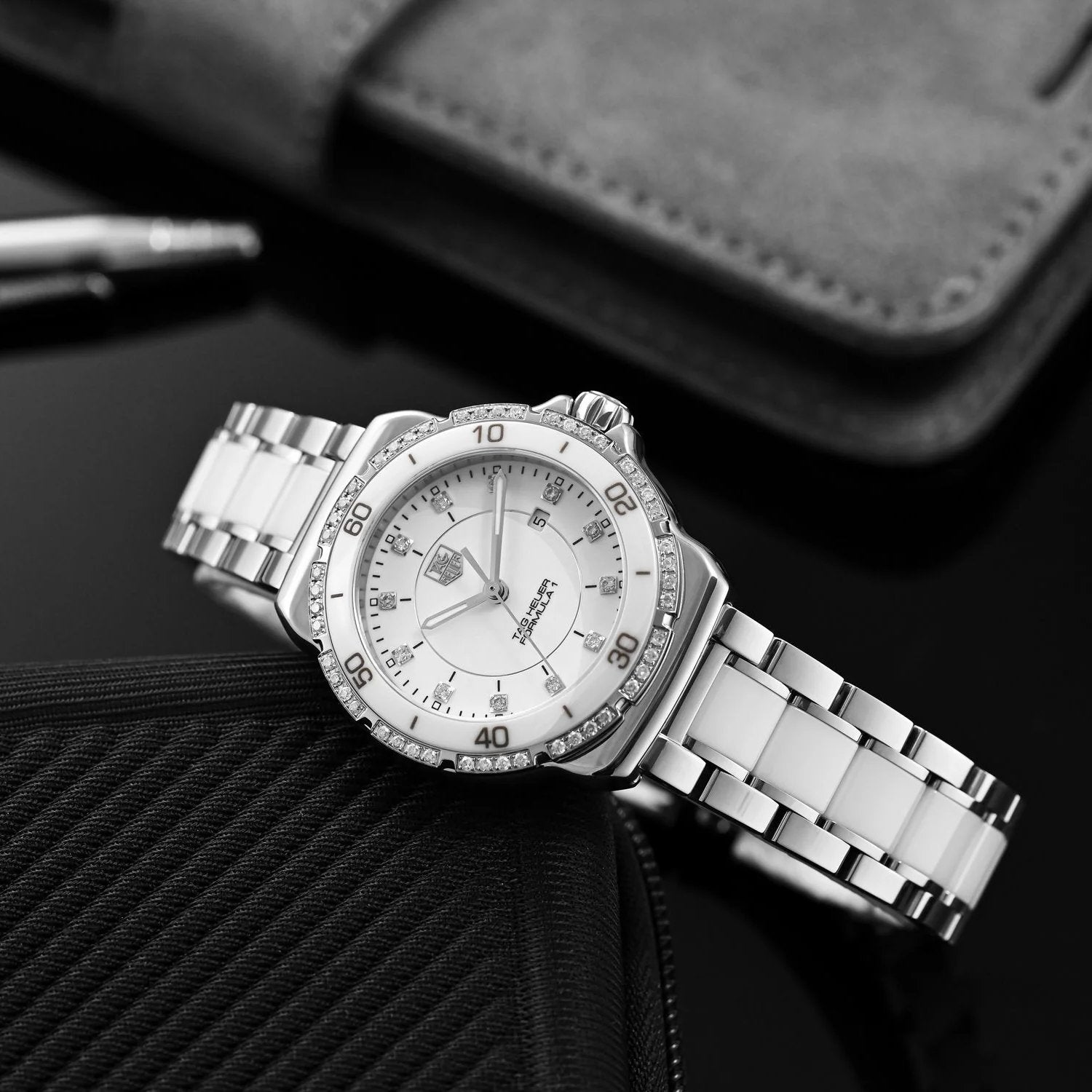 Ladies TAG Heuer 32mm Formula 1 Ceramic Watch with White Diamond Dial and Diamond Bezel. (Pre-Owned WAH1313)