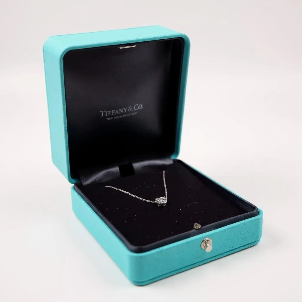 Tiffany & Co. 0.91 Carat Round VS1 / H Diamond Pendant with Platinum 16" Solitaire Necklace. (Pre-Owned)