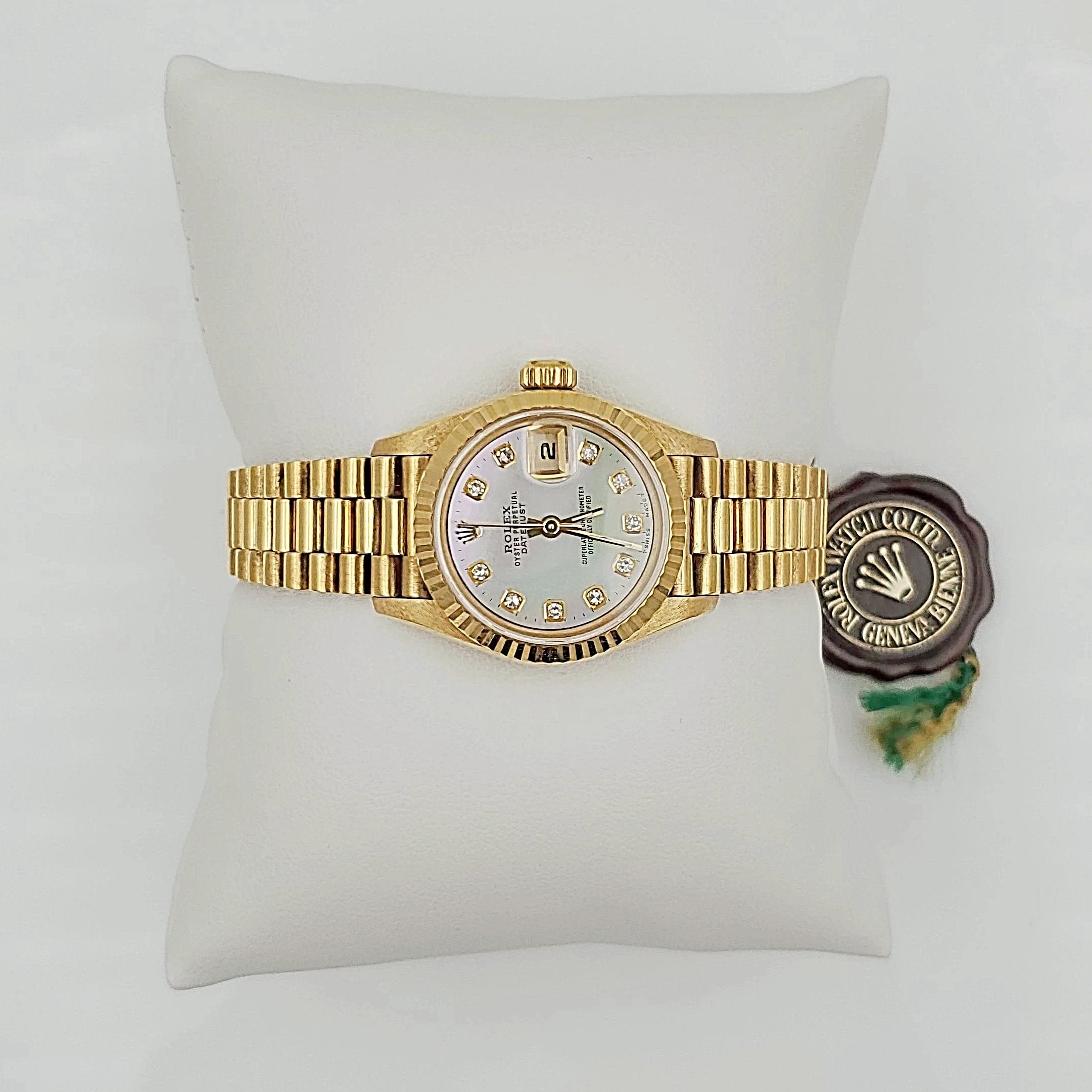 Ladies Rolex 26mm Presidential 18K Solid Yellow Gold Watch with Mother of Pearl Diamond Dial and Fluted Bezel. (Pre-Owned)