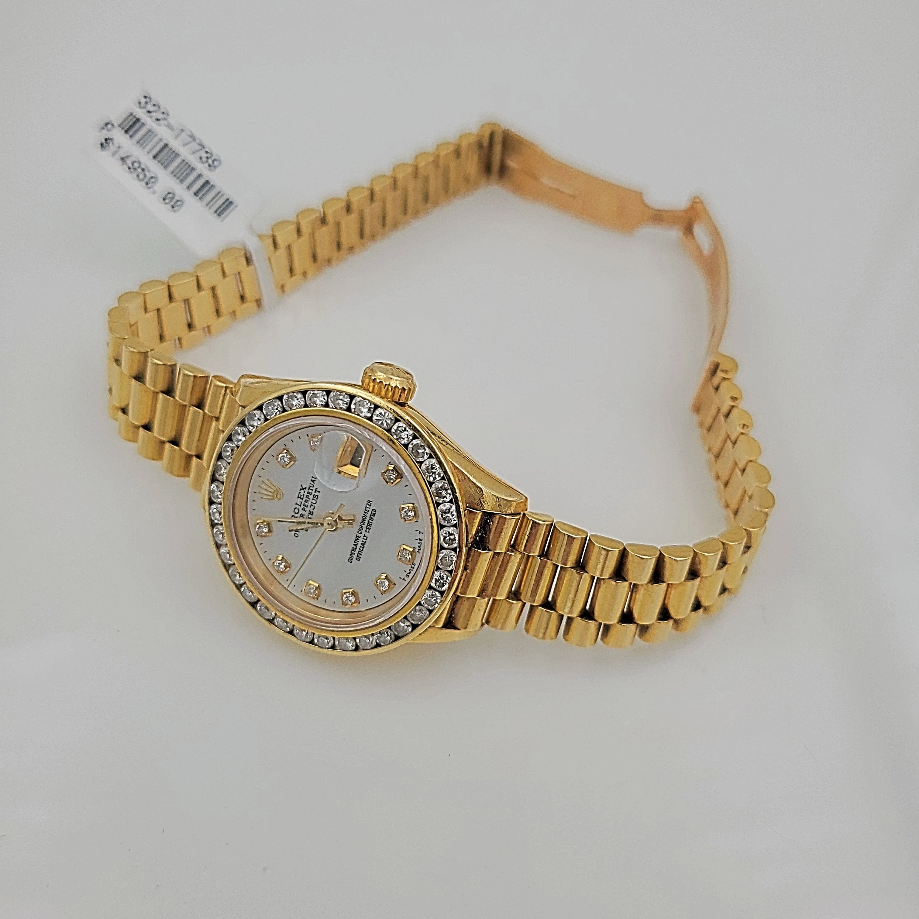 Ladies Rolex 26mm Presidential 18K Yellow Gold Watch with Mother of Pearl Diamond Dial and Diamond Bezel. (Pre-Owned)