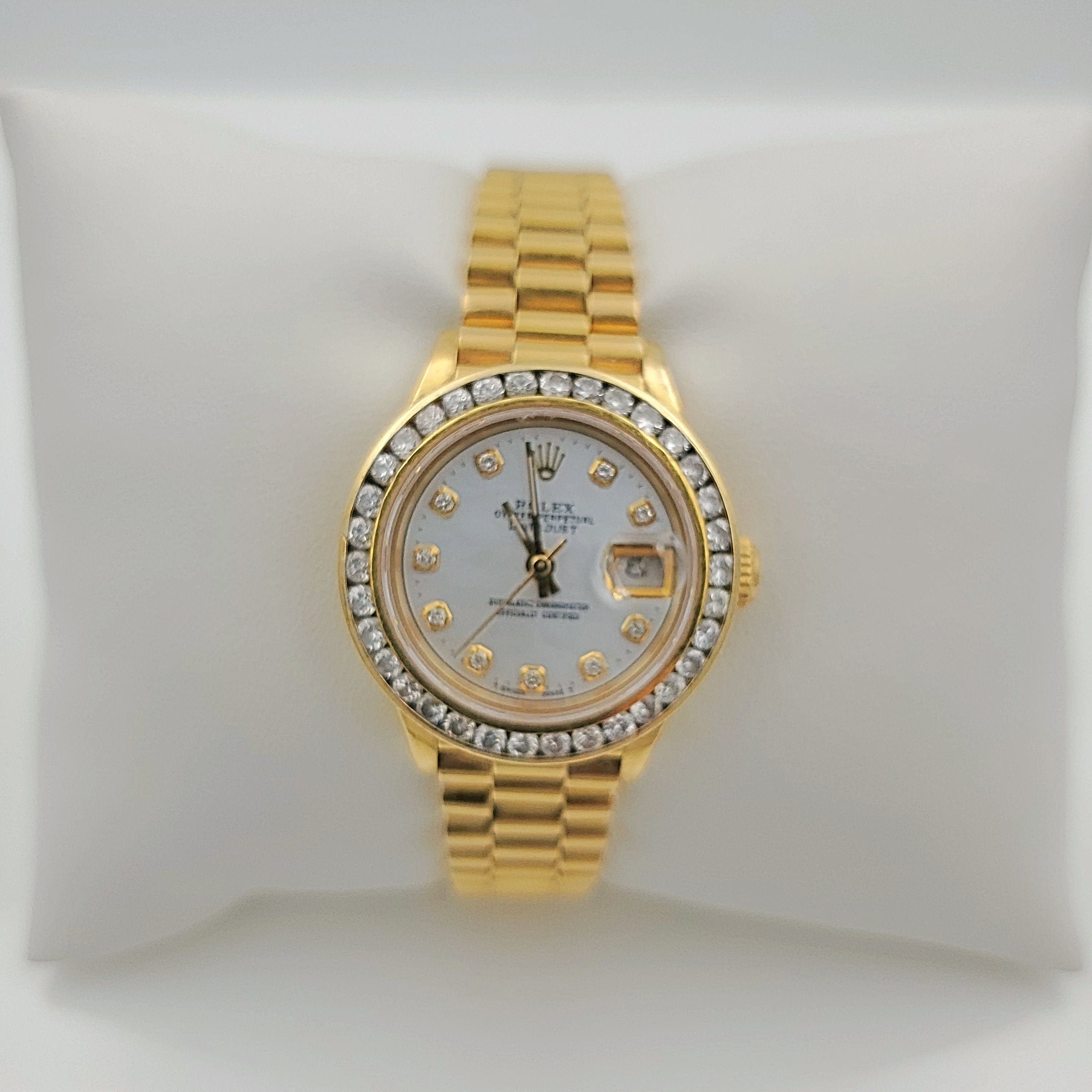 Ladies Rolex 26mm Presidential 18K Yellow Gold Watch with Mother of Pearl Diamond Dial and Diamond Bezel. (Pre-Owned)