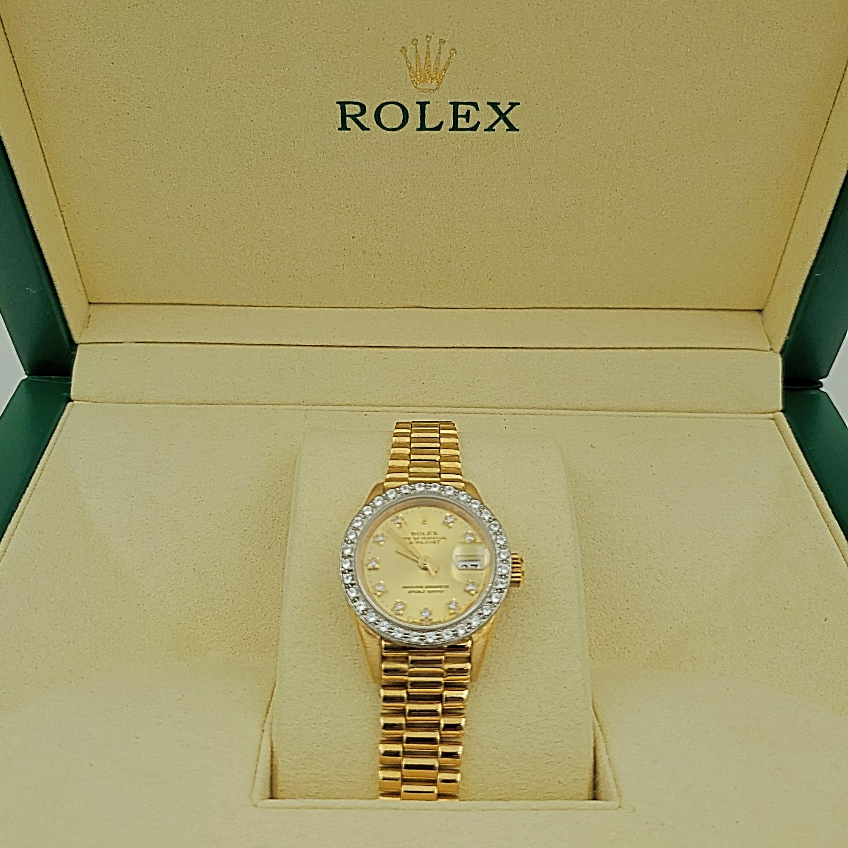 Ladies Rolex 26mm Presidential 18K Yellow Gold Watch with Champagne Diamond Dial and Diamond Bezel. (Pre-Owned)