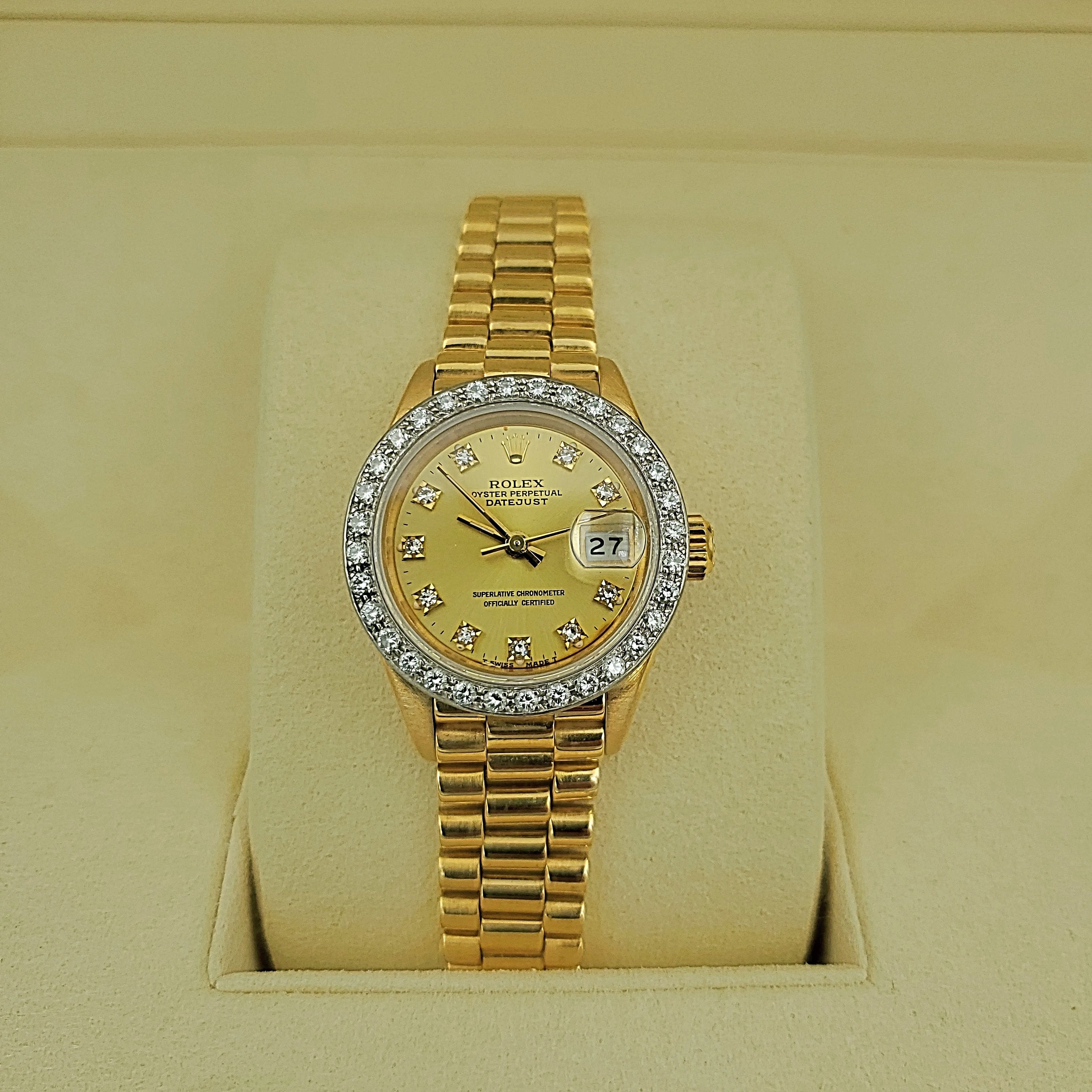 Ladies Rolex 26mm Presidential 18K Yellow Gold Watch with Champagne Diamond Dial and Diamond Bezel. (Pre-Owned)