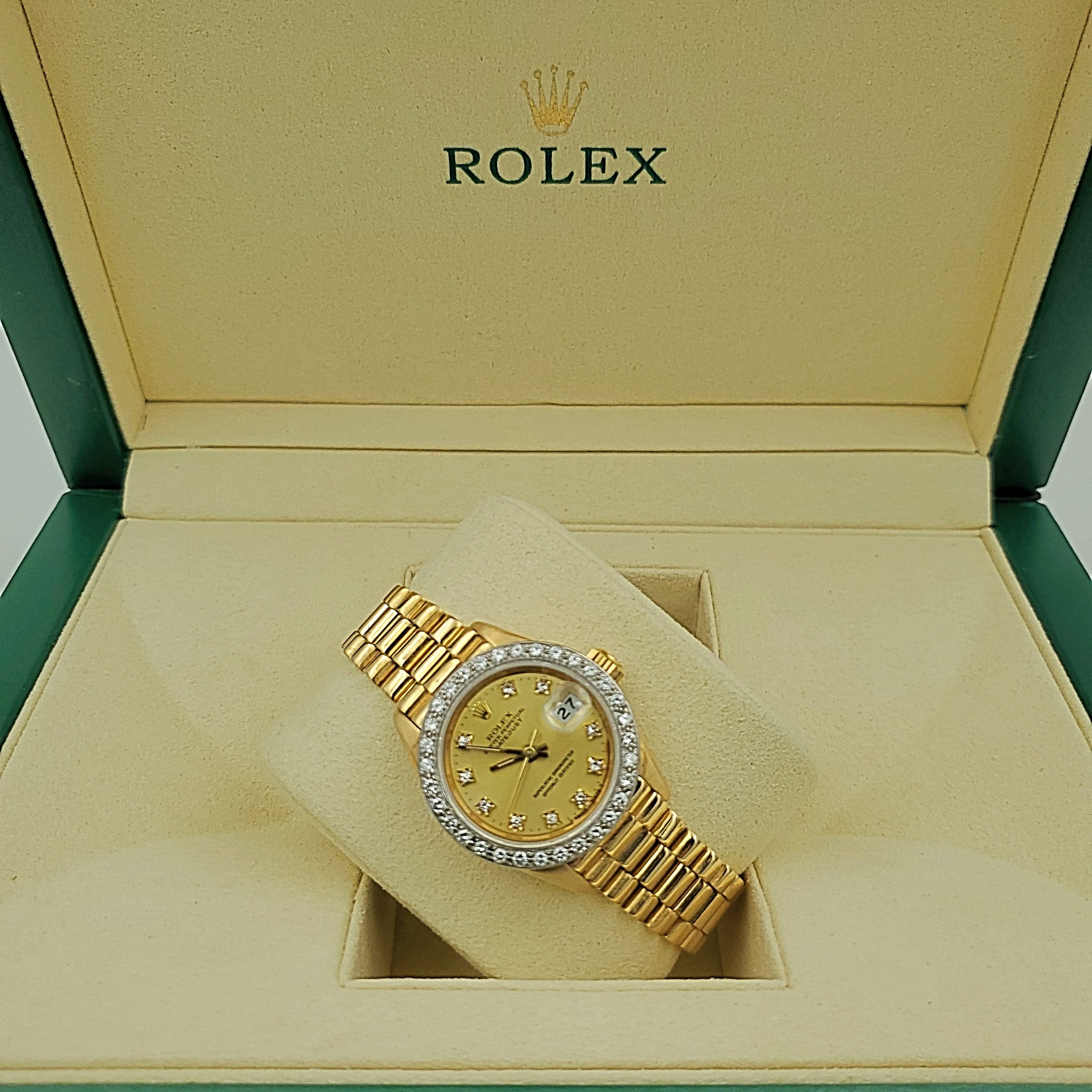 Ladies Rolex 26mm Presidential 18K Yellow Gold Watch with Champagne Diamond Dial and Diamond Bezel. (Pre-Owned)