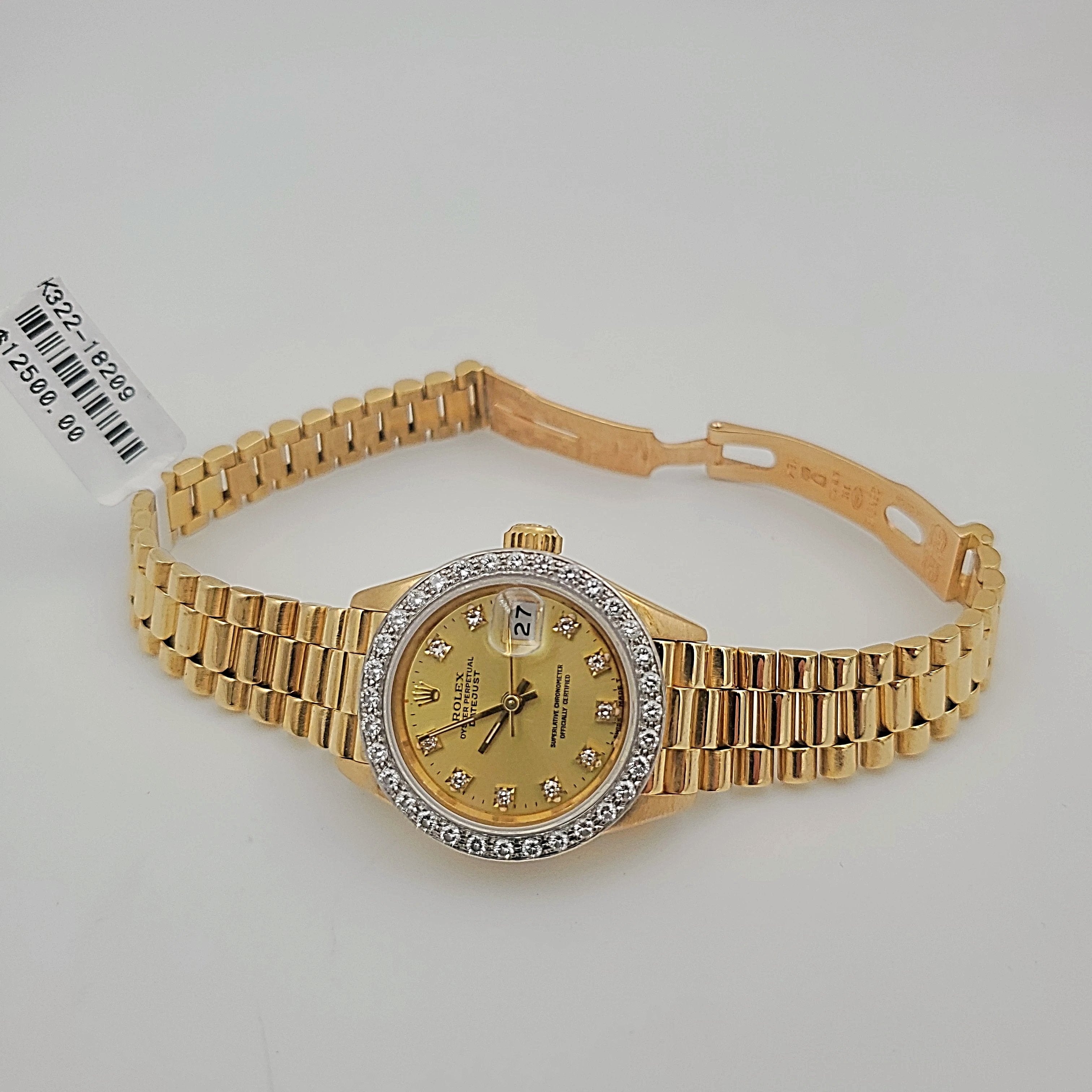 Ladies Rolex 26mm Presidential 18K Yellow Gold Watch with Champagne Diamond Dial and Diamond Bezel. (Pre-Owned)