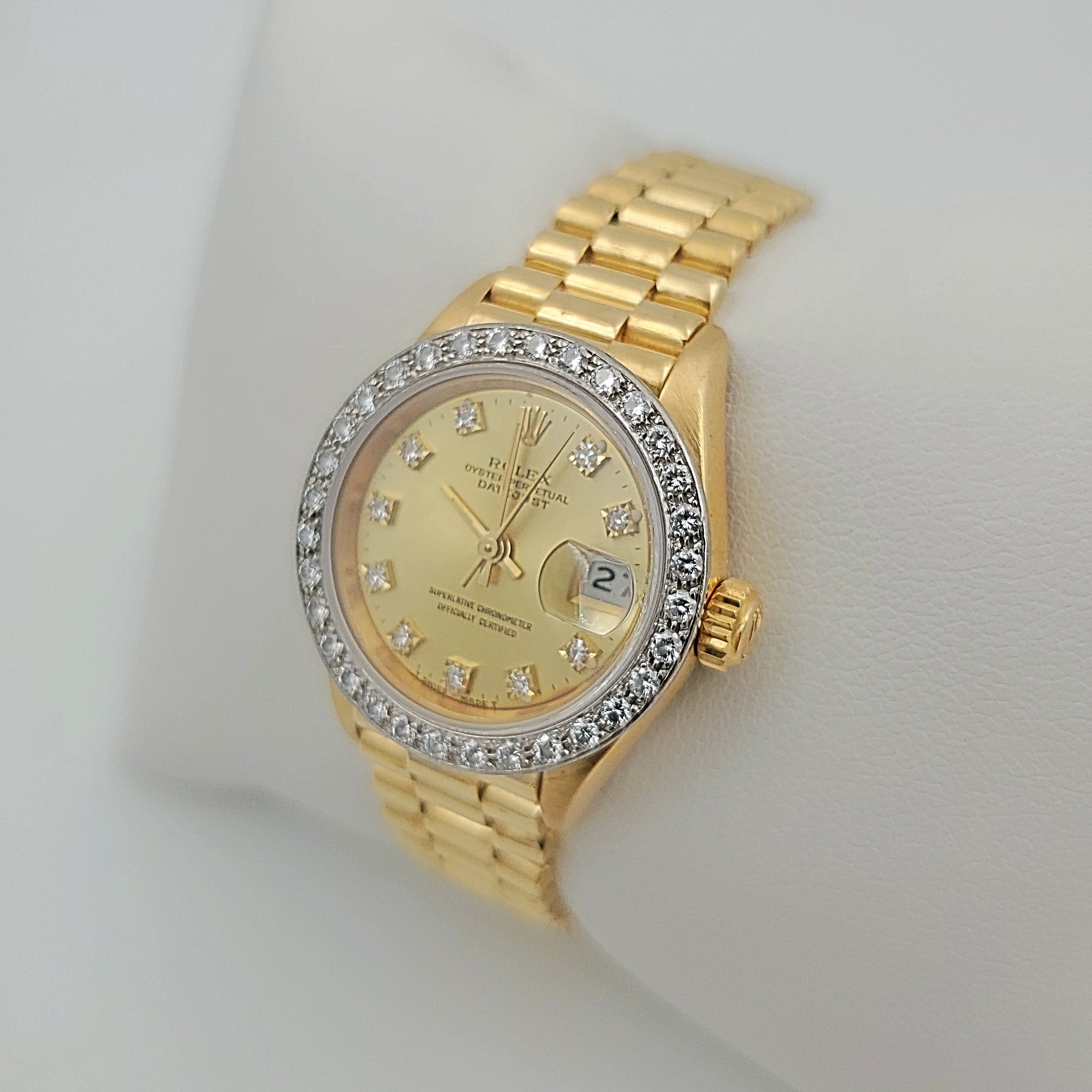 Ladies Rolex 26mm Presidential 18K Yellow Gold Watch with Champagne Diamond Dial and Diamond Bezel. (Pre-Owned)