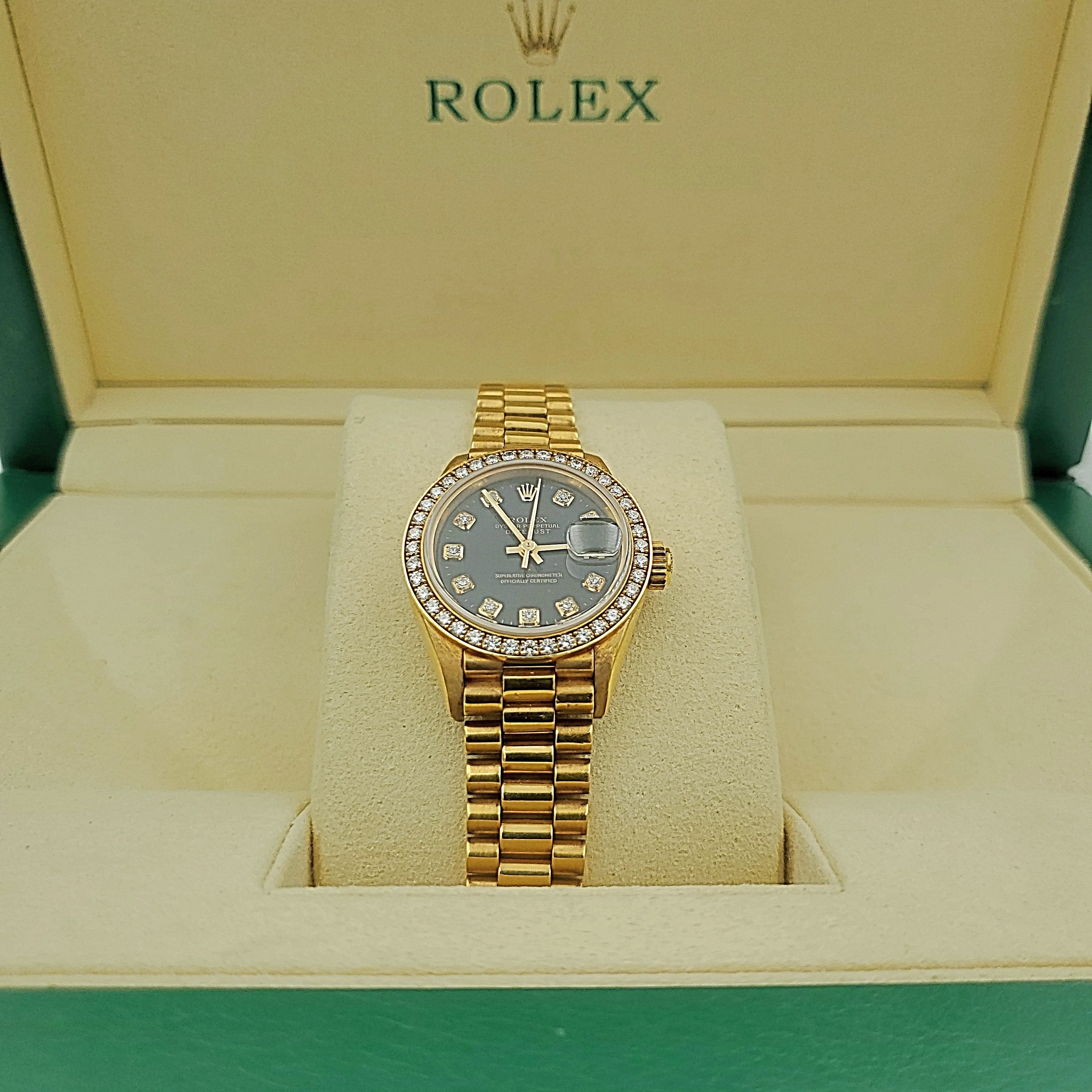 Ladies Rolex 26mm Presidential 18K Yellow Gold Watch with Black Diamond Dial and Diamond Bezel. (Pre-Owned)