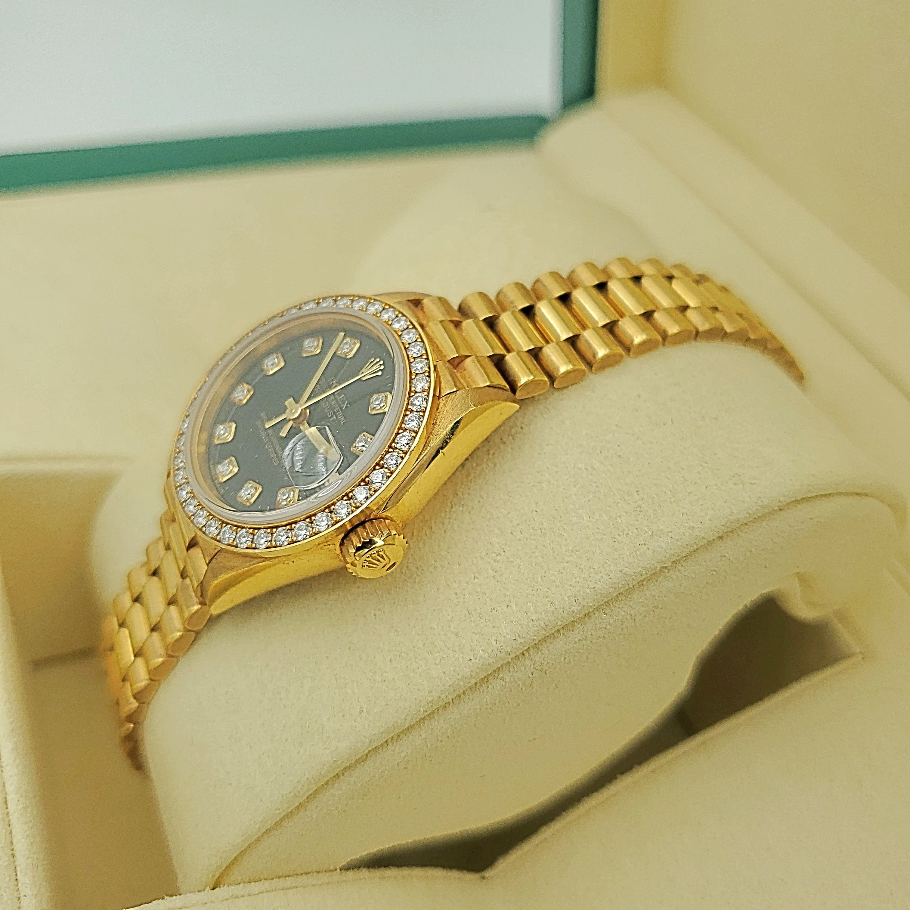 Ladies Rolex 26mm Presidential 18K Yellow Gold Watch with Black Diamond Dial and Diamond Bezel. (Pre-Owned)