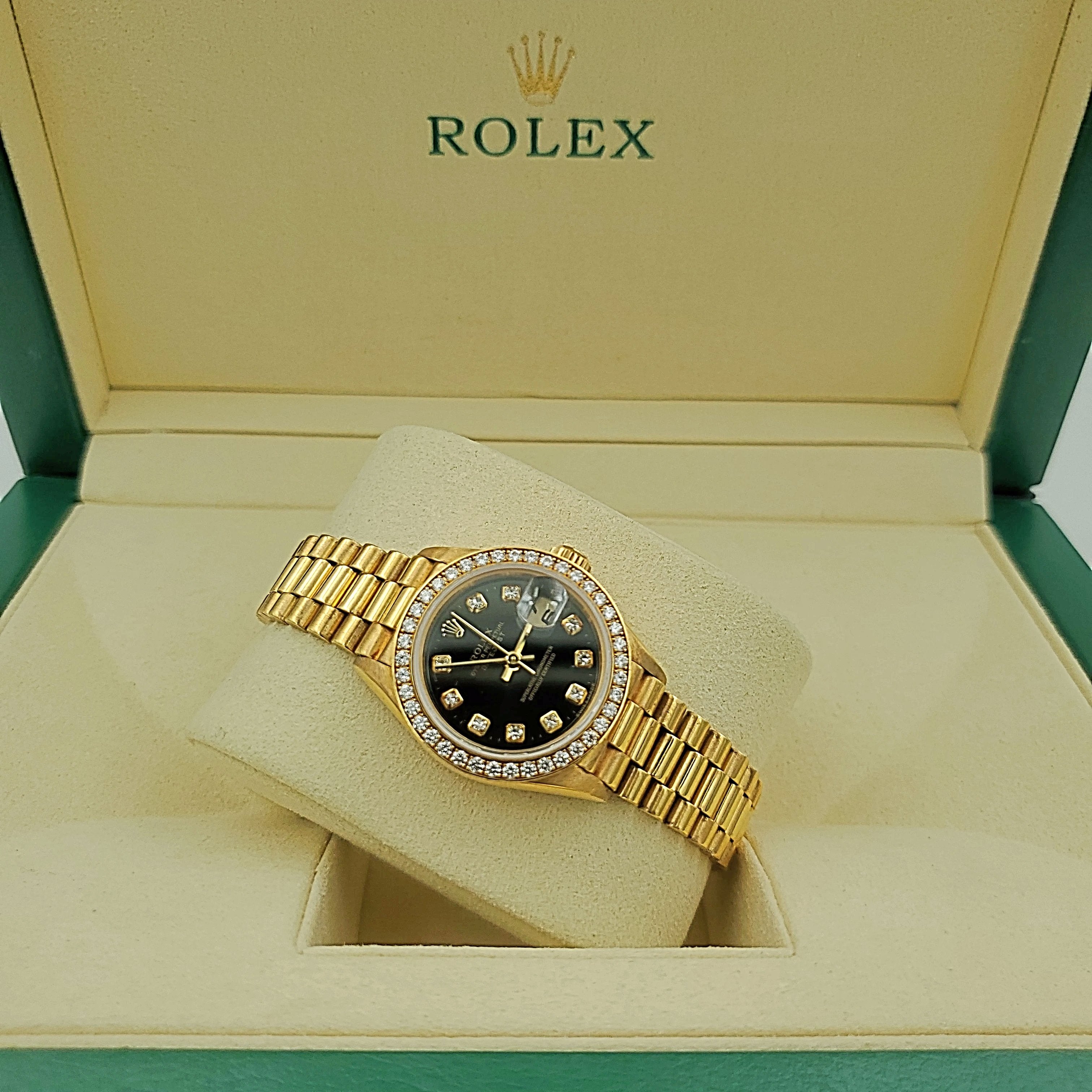 Ladies Rolex 26mm Presidential 18K Yellow Gold Watch with Black Diamond Dial and Diamond Bezel. (Pre-Owned)