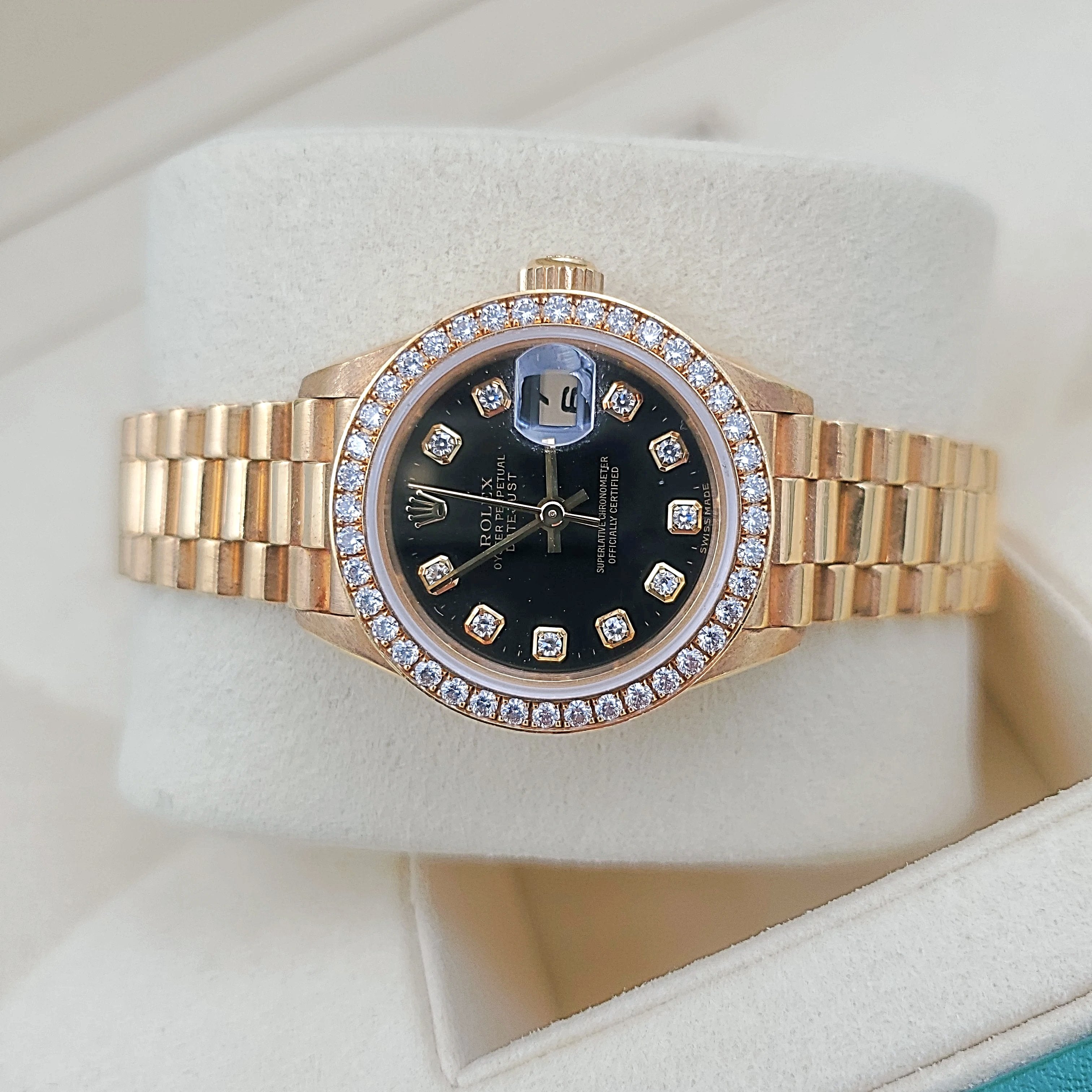 Ladies Rolex 26mm Presidential 18K Yellow Gold Watch with Black Diamond Dial and Diamond Bezel. (Pre-Owned)