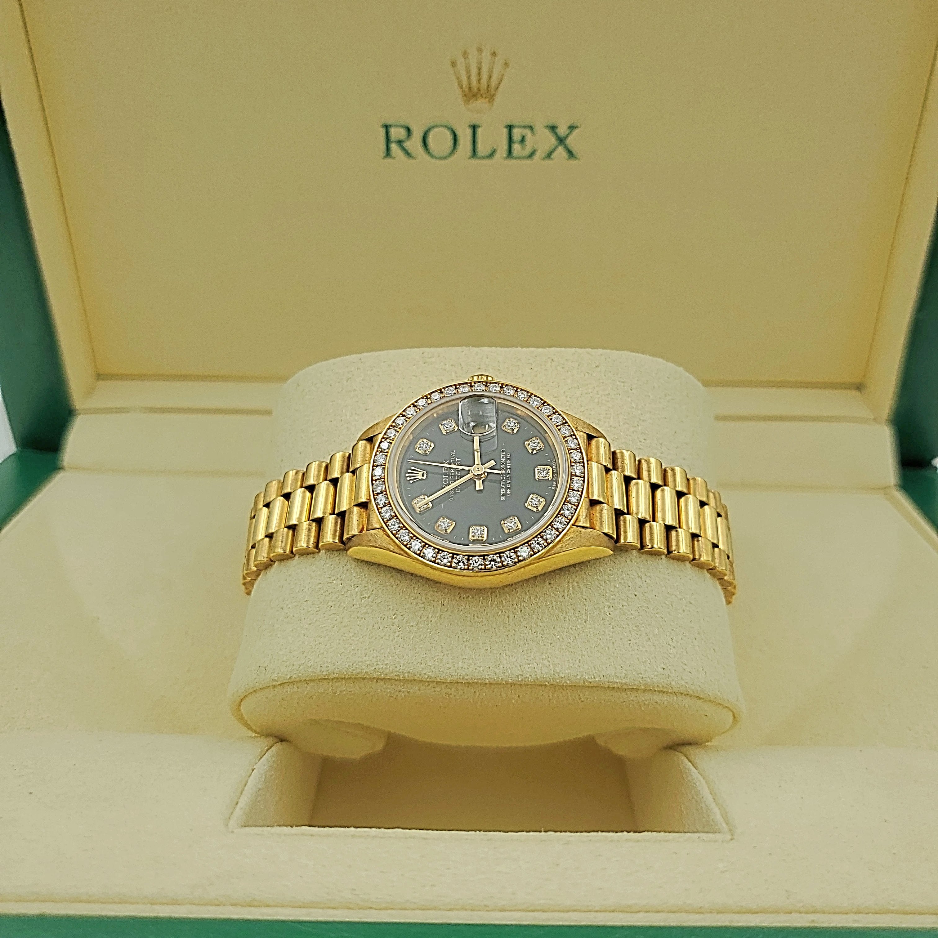 Ladies Rolex 26mm Presidential 18K Yellow Gold Watch with Black Diamond Dial and Diamond Bezel. (Pre-Owned)