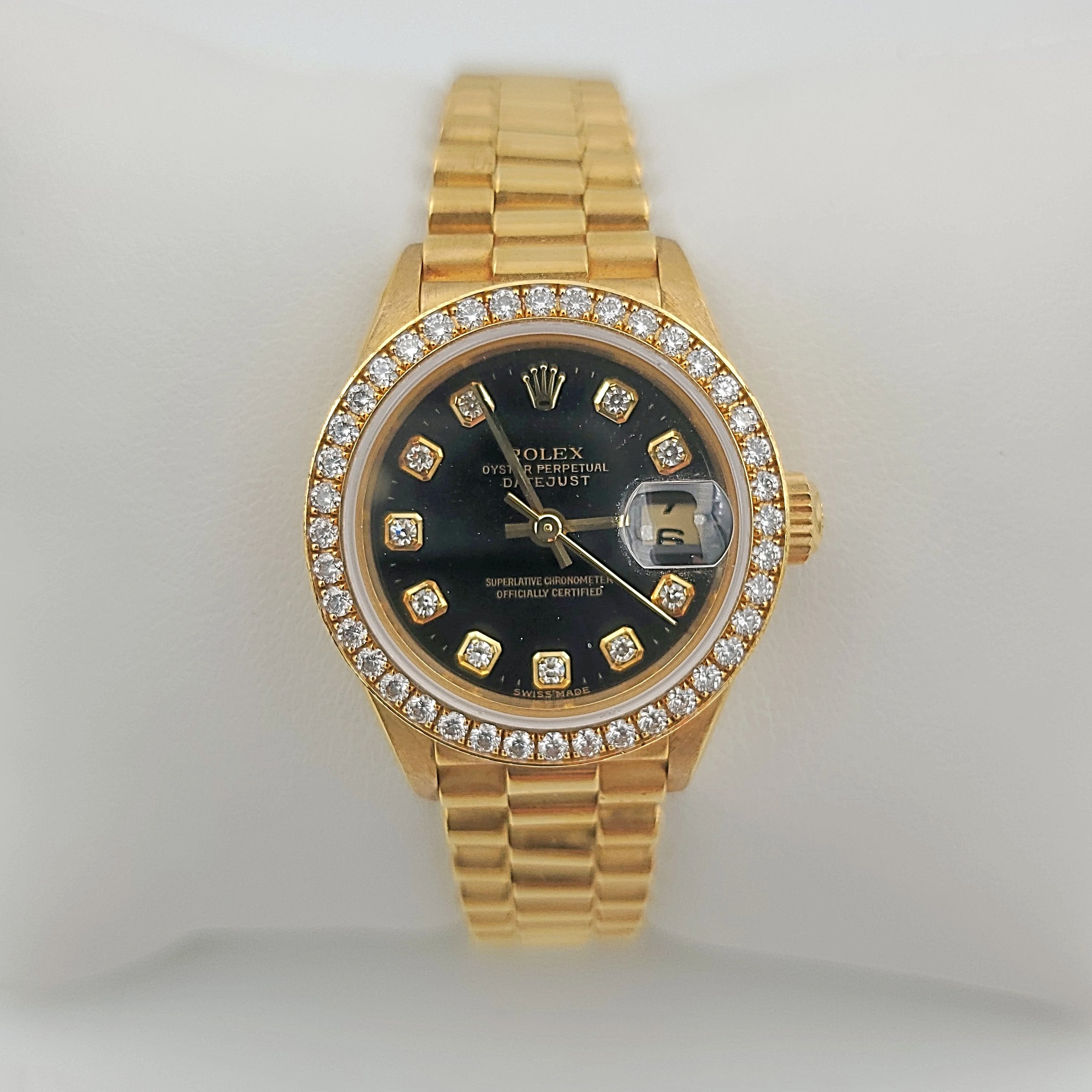 Ladies Rolex 26mm Presidential 18K Yellow Gold Watch with Black Diamond Dial and Diamond Bezel. (Pre-Owned)