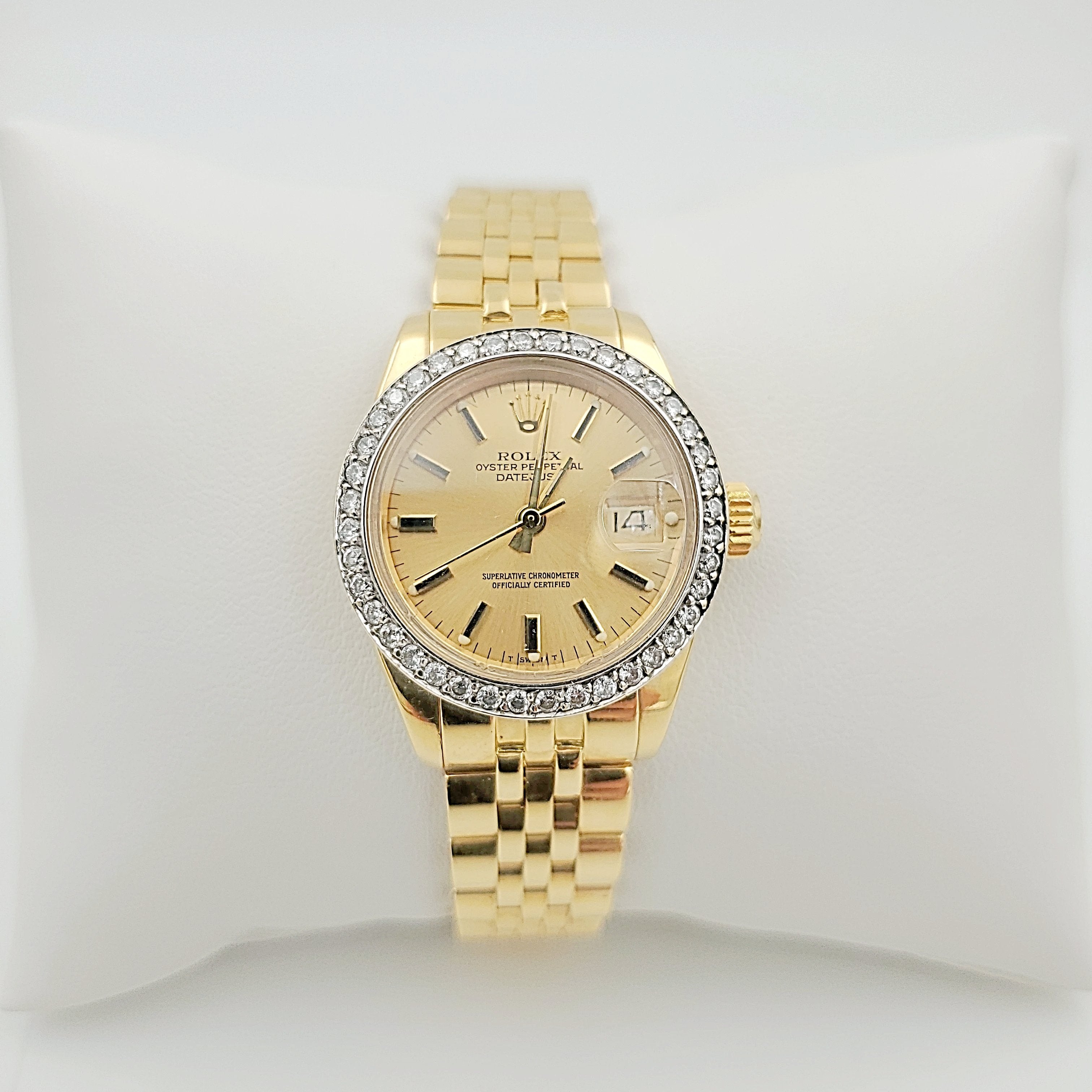 Ladies Rolex 26mm DateJust 18K Yellow Gold Watch with Champagne Dial and Custom Diamond Bezel. (Pre-Owned)