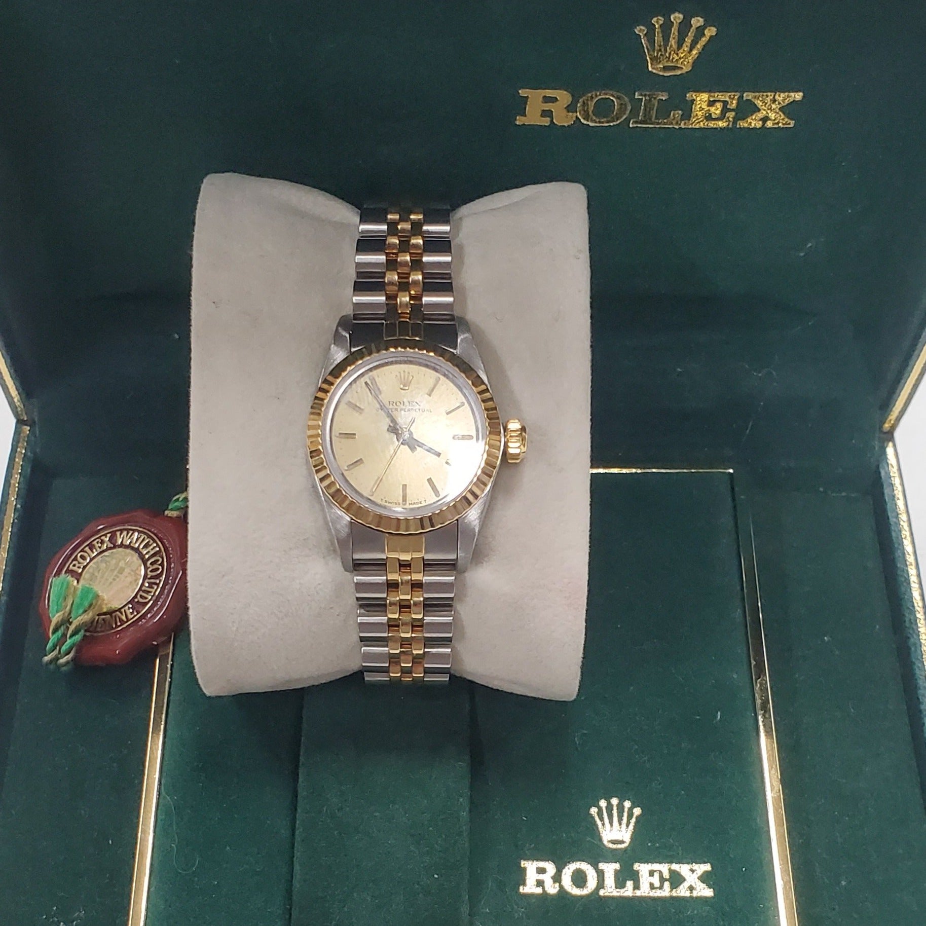 Ladies Rolex 26mm DateJust Two Tone 18K Gold Watch with Champagne Dial and 18k Fluted Bezel. (Pre-Owned)