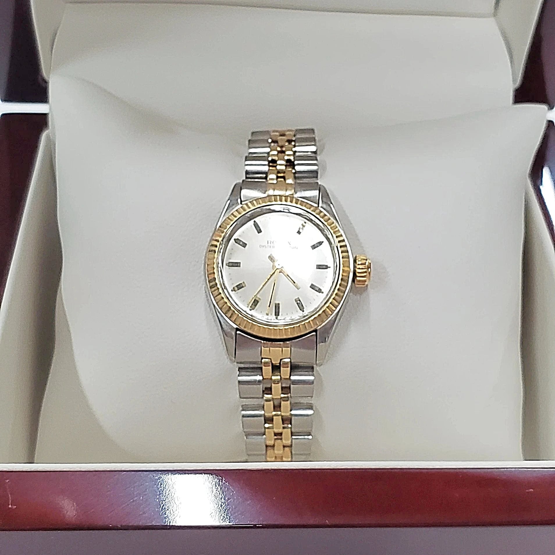 Ladies Rolex 26mm Two Tone DateJust 14K Gold Watch with Silver Dial and Fluted Bezel. (Pre-Owned)