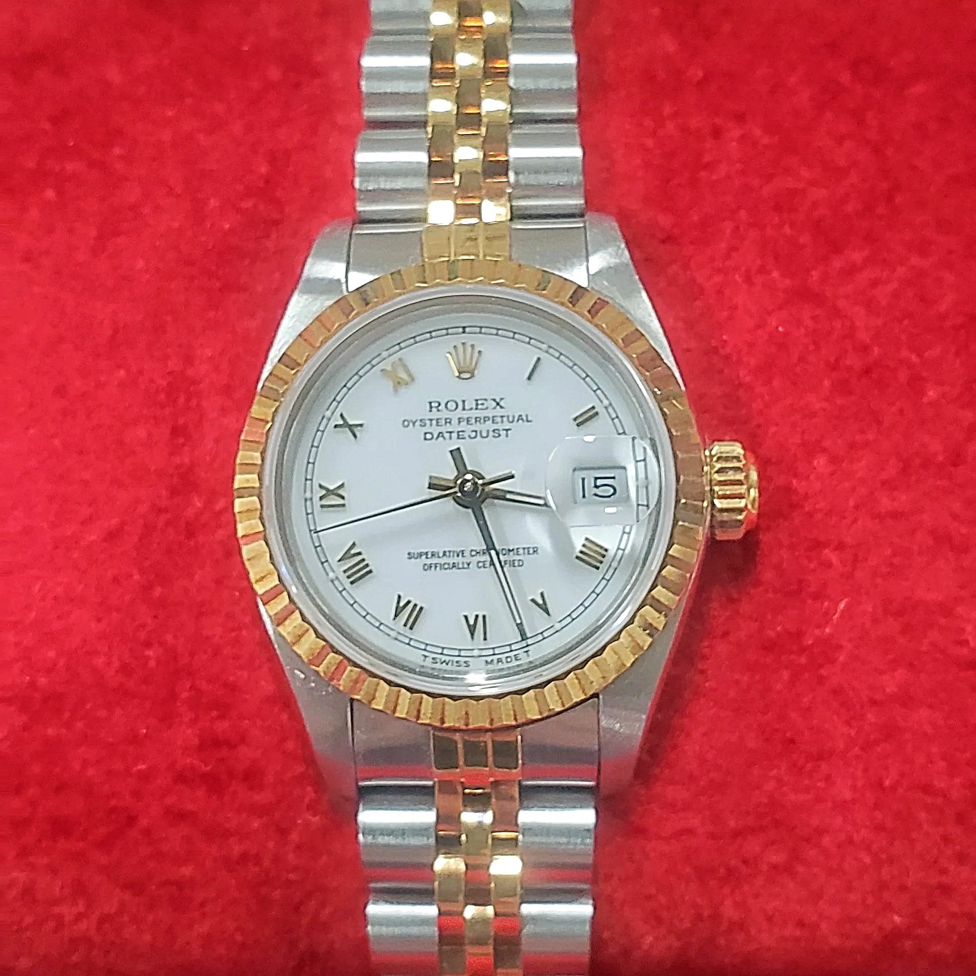 Ladies Rolex 26mm DateJust Two Tone 18K Gold Watch with White Dial, Fluted Bezel and Roman Numerals. (Pre-Owned)