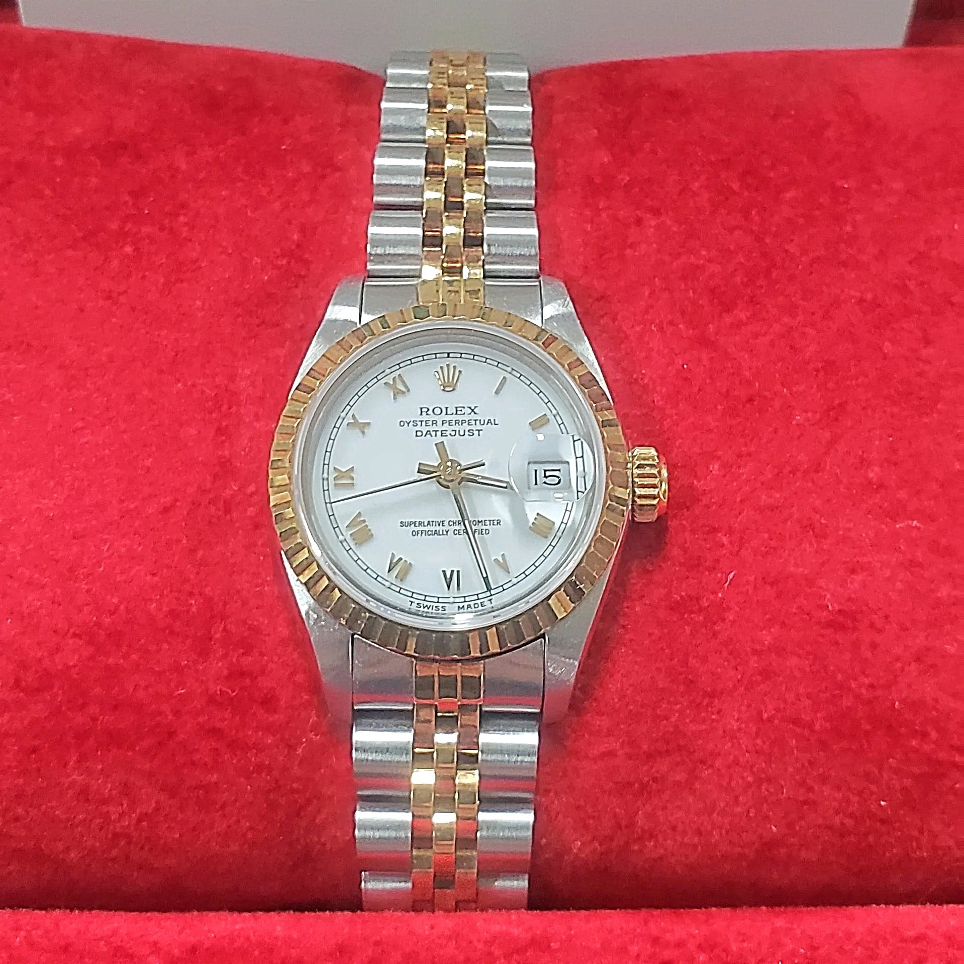 Ladies Rolex 26mm DateJust Two Tone 18K Gold Watch with White Dial, Fluted Bezel and Roman Numerals. (Pre-Owned)