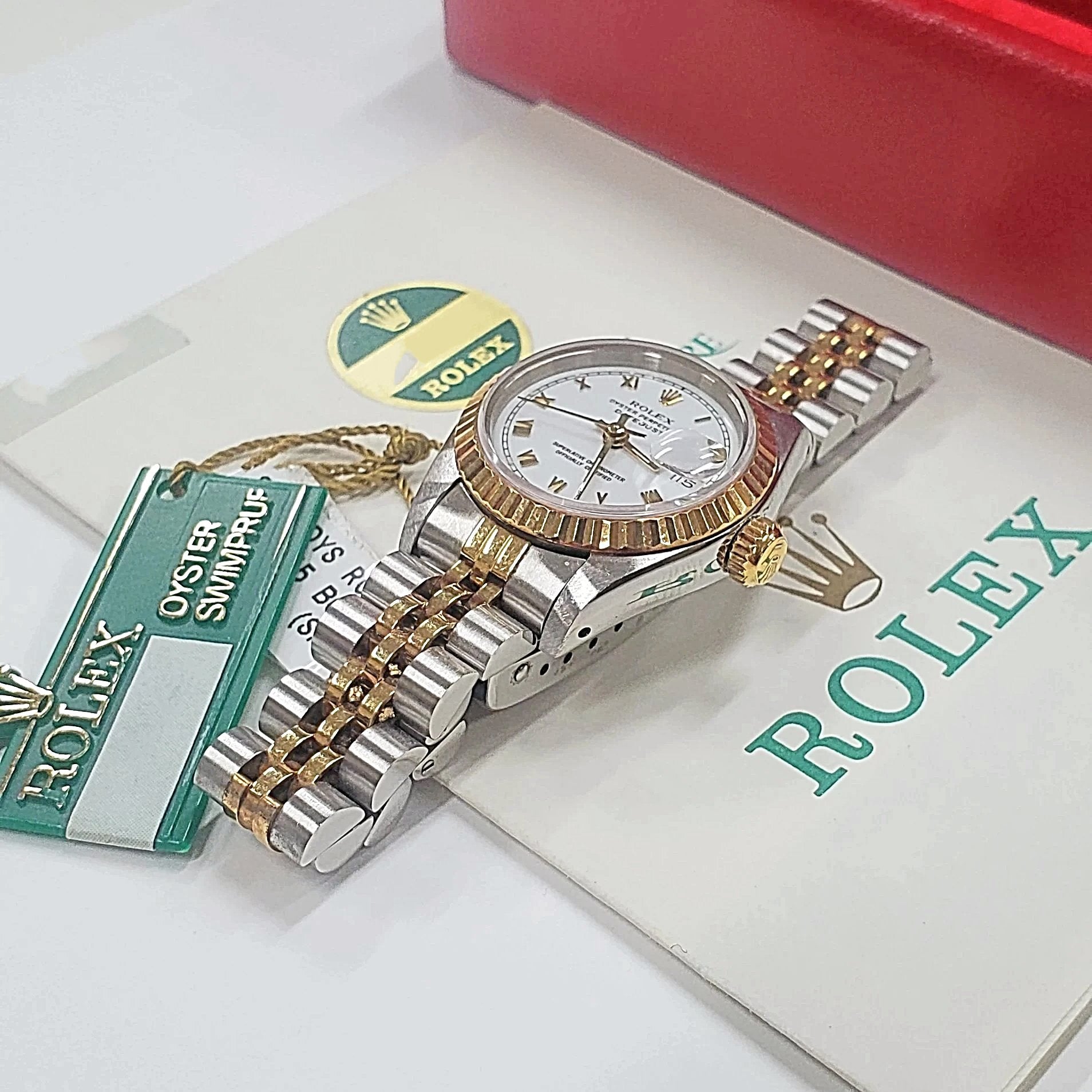 Ladies Rolex 26mm DateJust Two Tone 18K Gold Watch with White Dial, Fluted Bezel and Roman Numerals. (Pre-Owned)