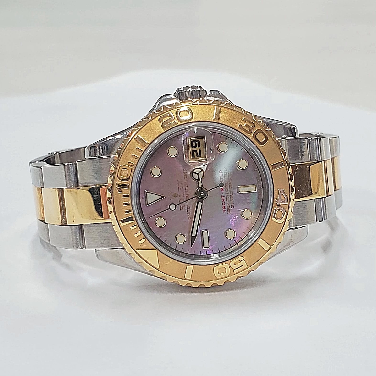 Ladies Rolex 29mm Two Tone 18K Gold Yachtmaster Watch with Black Mother of Pearl Dial and Rotatable Bezel. (Pre-Owned)