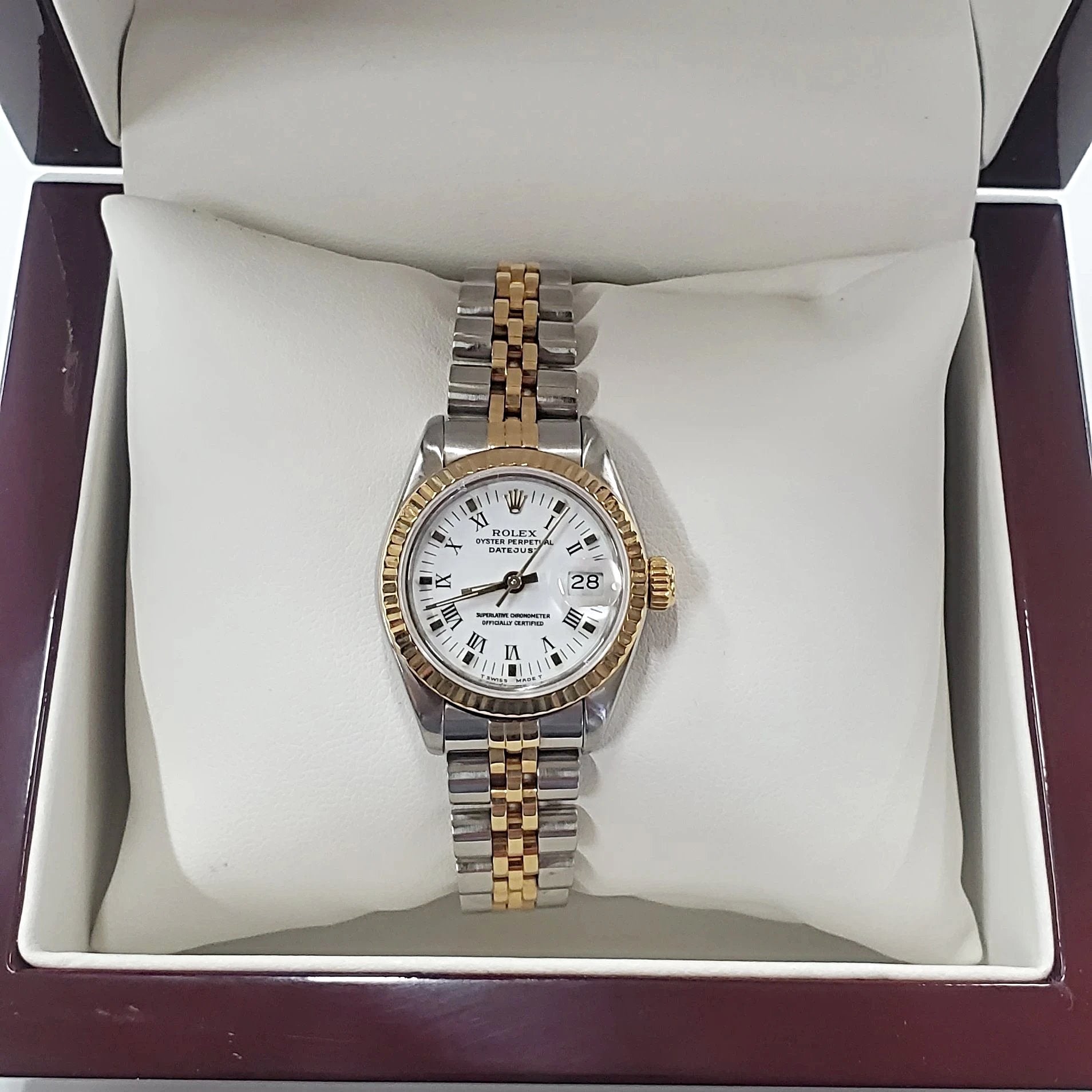 Ladies Rolex 26mm DateJust Two Tone 18K Gold Watch with Fluted Bezel, White Dial and Roman Numerals. (Pre-Owned)