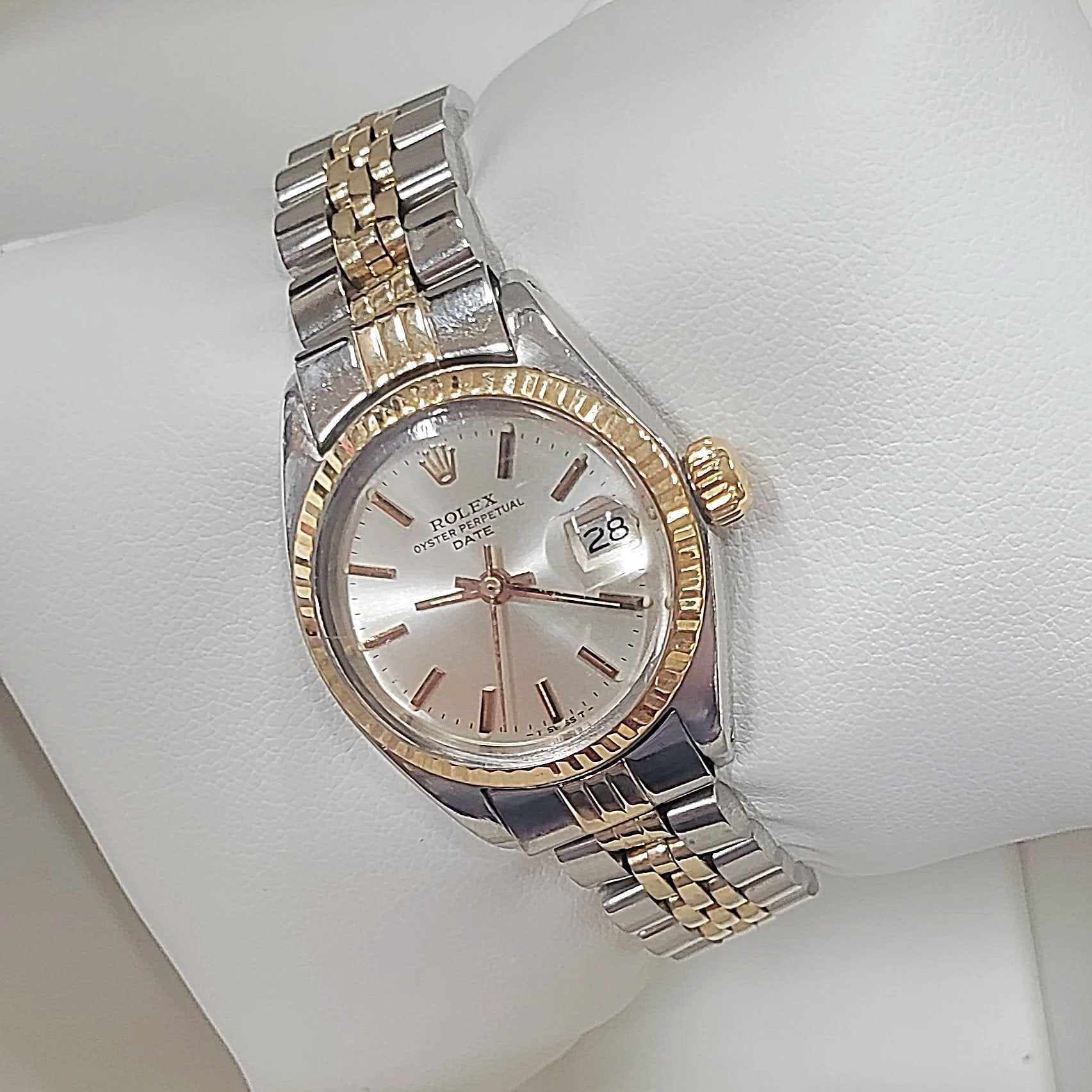 Ladies Rolex 26mm DateJust Two Tone 14K Yellow Gold / Stainless Steel Watch with Silver Dial and Fluted Bezel. (Pre-Owned)