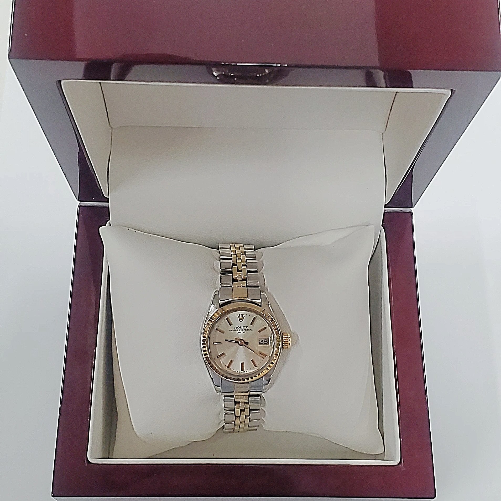 Ladies Rolex 26mm DateJust Two Tone 14K Yellow Gold / Stainless Steel Watch with Silver Dial and Fluted Bezel. (Pre-Owned)