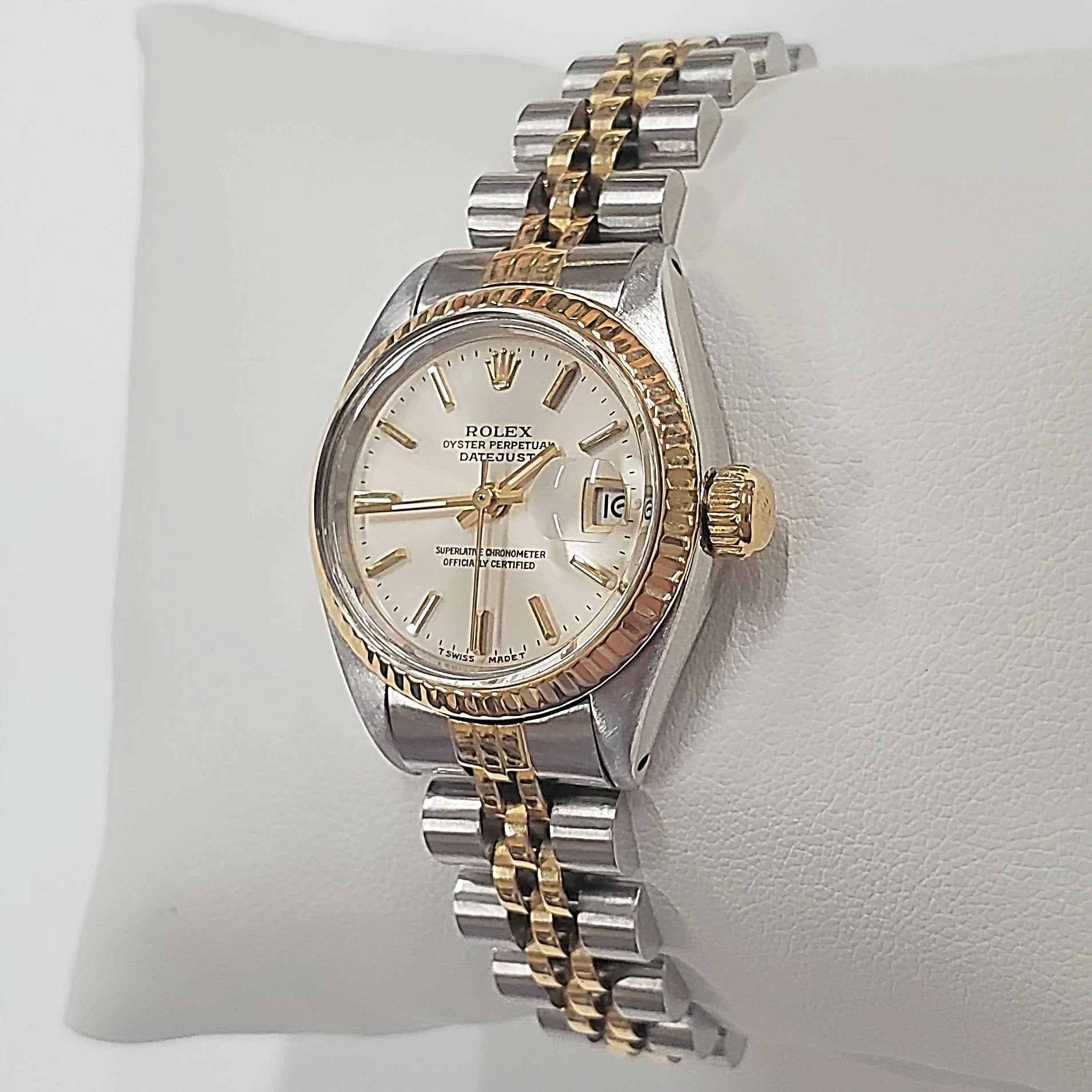 Ladies Rolex 26mm DateJust Two Tone 14K Yellow Gold / Stainless Steel Watch with Silver Dial and Fluted Bezel. (Pre-Owned)