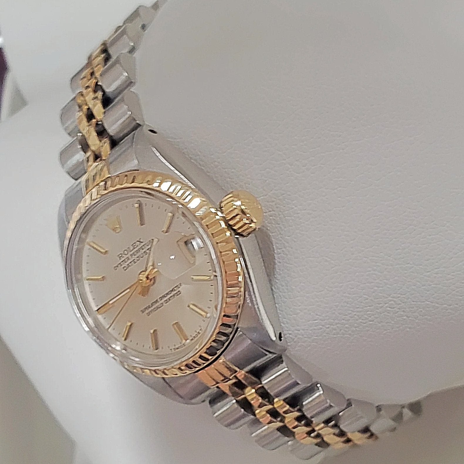 Ladies Rolex 26mm DateJust Two Tone 14K Yellow Gold / Stainless Steel Watch with Silver Dial and Fluted Bezel. (Pre-Owned)