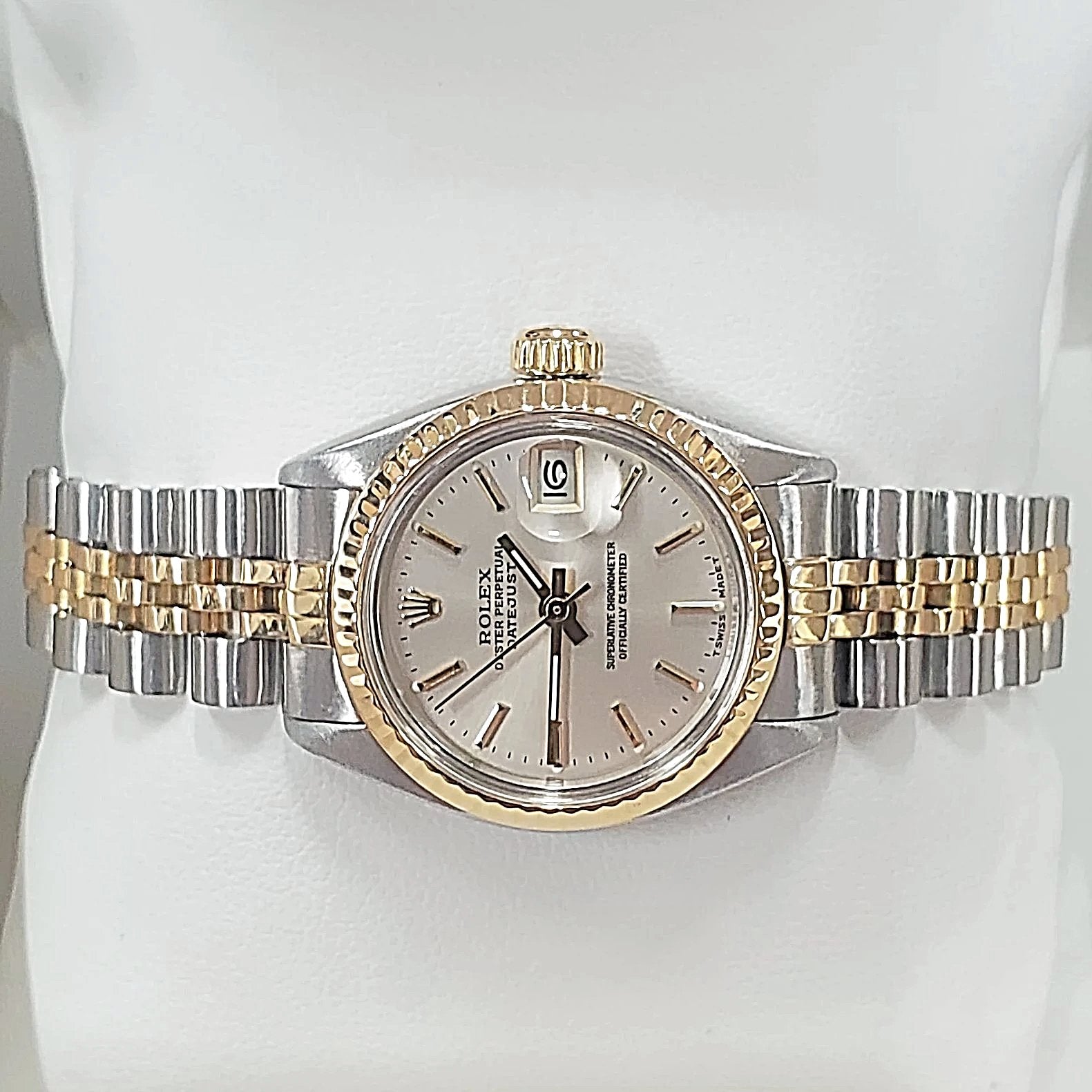 Ladies Rolex 26mm DateJust Two Tone 14K Yellow Gold / Stainless Steel Watch with Silver Dial and Fluted Bezel. (Pre-Owned)