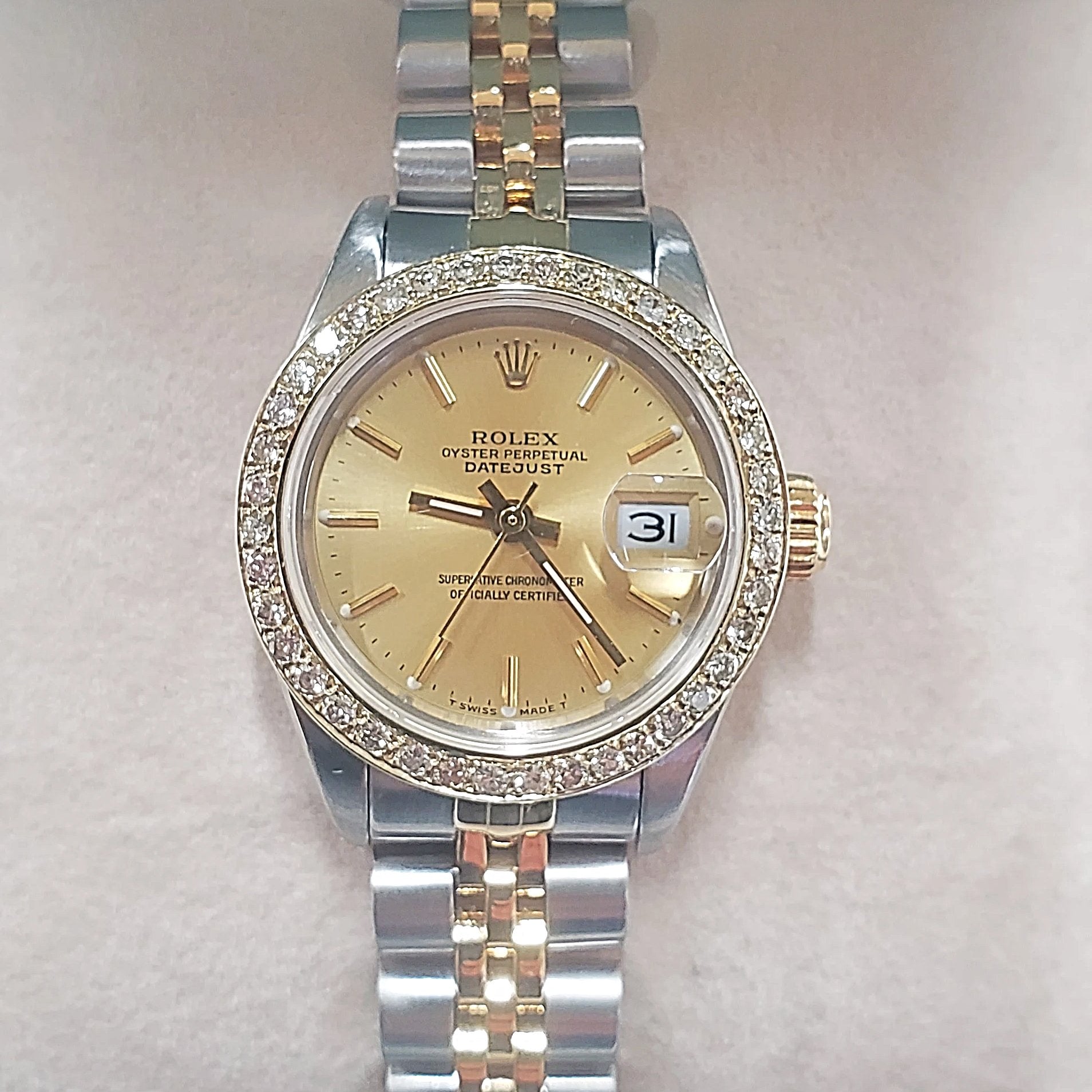 Ladies Rolex 26mm DateJust Two Tone 18K Gold Watch with Champagne Dial and Custom Diamond Bezel. (Pre-Owned)