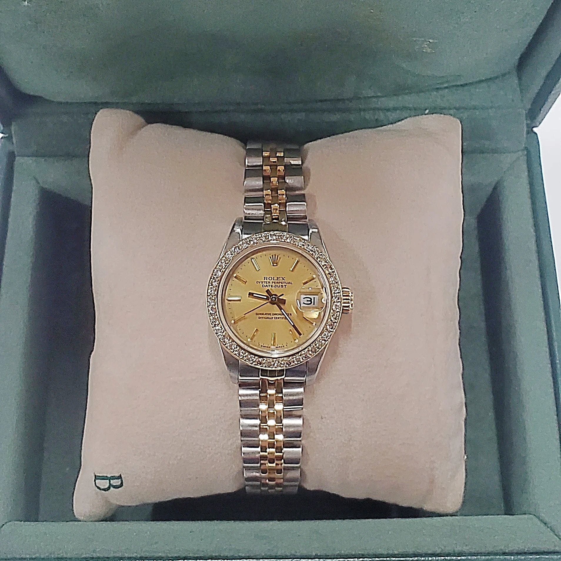 Ladies Rolex 26mm DateJust Two Tone 18K Gold Watch with Champagne Dial and Custom Diamond Bezel. (Pre-Owned)